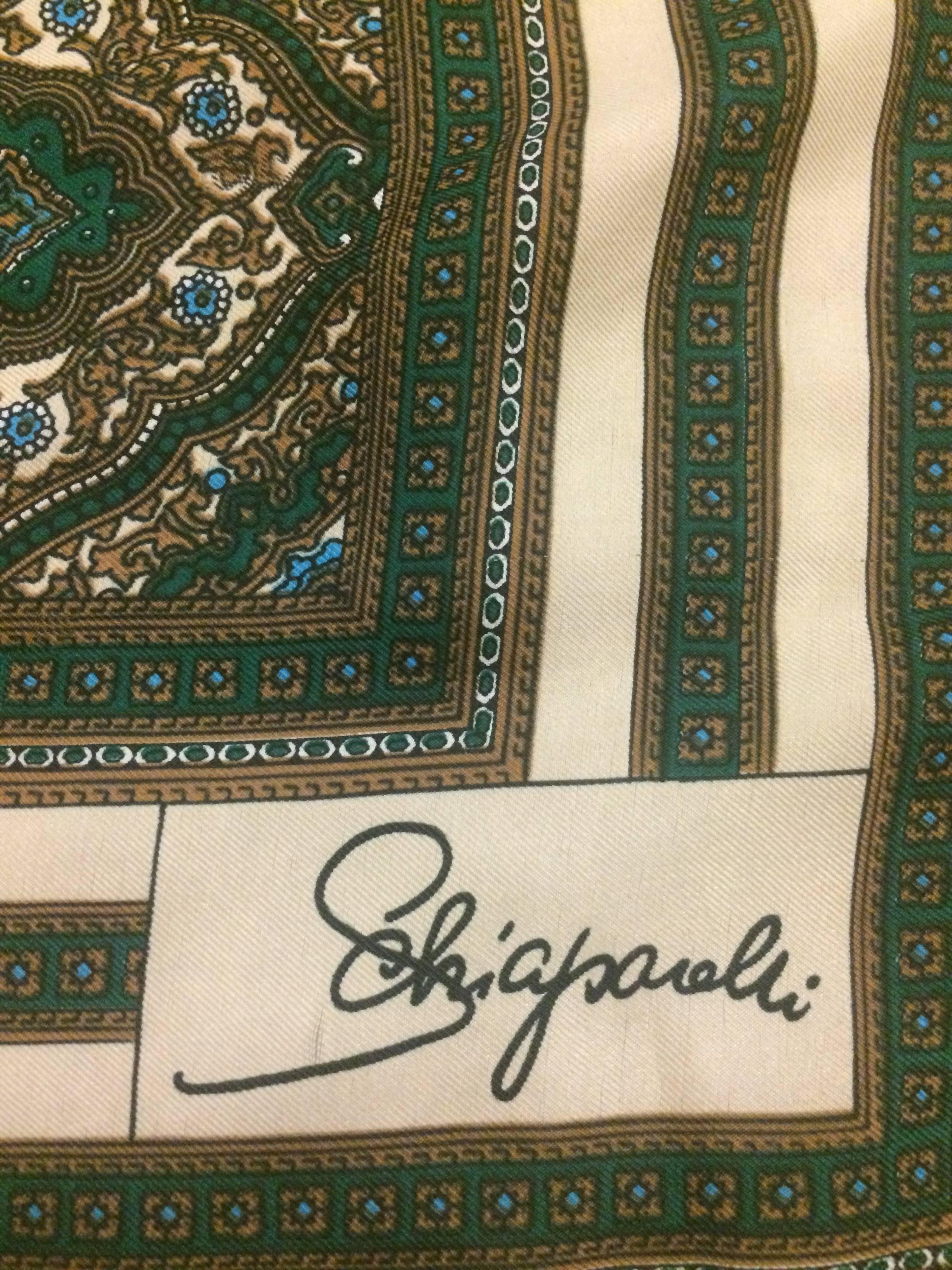 Schiaparelli for Glentex scarf in a cream, brown, green & blue print.

30% silk, 70% rayon.

Made in Japan.

Approximately 22 1/2