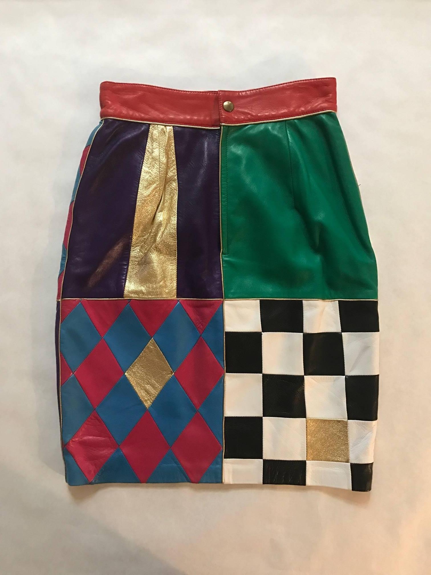 Vintage 1980's Moschino Leather patchwork pencil skirt. Features red and blue harlequin print, stripes, checks, and floral embroidery with gold accents. Super sexy slim pencil silhouette. Back zip and snap. 

100% leather.
Fully lined in 70%