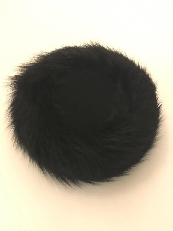 Joseph Magnin 1960s black fur felt hat with a fox fur band around sides. 

Approximately 4