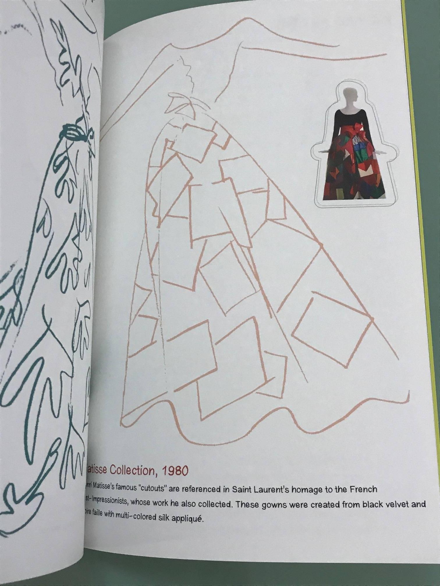 Yves Saint Laurent handcrafted coloring book from Neiman Marcus. A fun trip through some of Saint Laurent's most iconic designs, including some previously unpublished images. Bound in gold Saffiano leather. 

Approximately 12