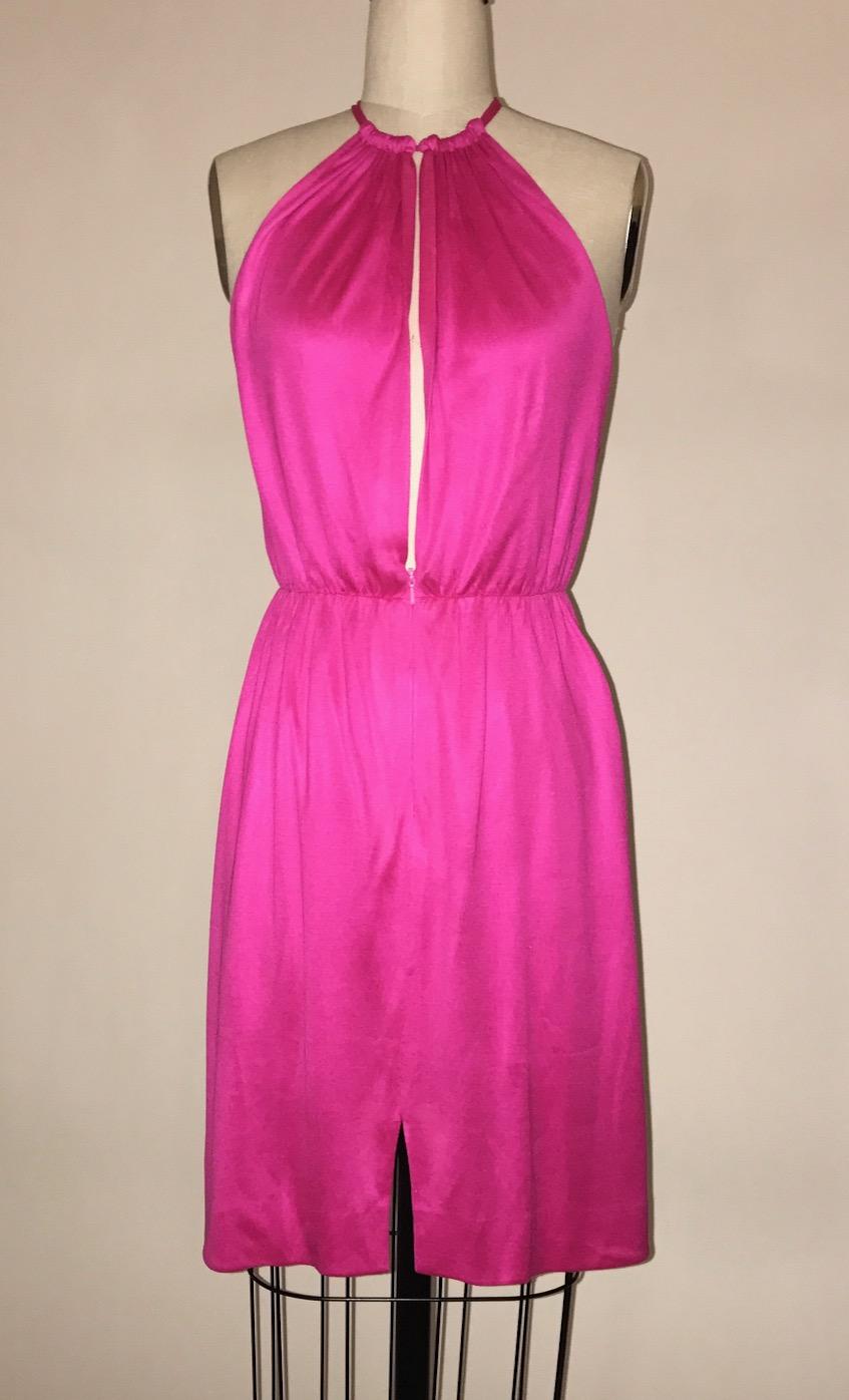 Stephen Sprouse slit front jersey dress in day-glo pink. Invisible zip up front skirt, hook and eye at neck.

100% silk.

Made in Hong Kong.

Labelled size US 4, see measurements.
Bust 30