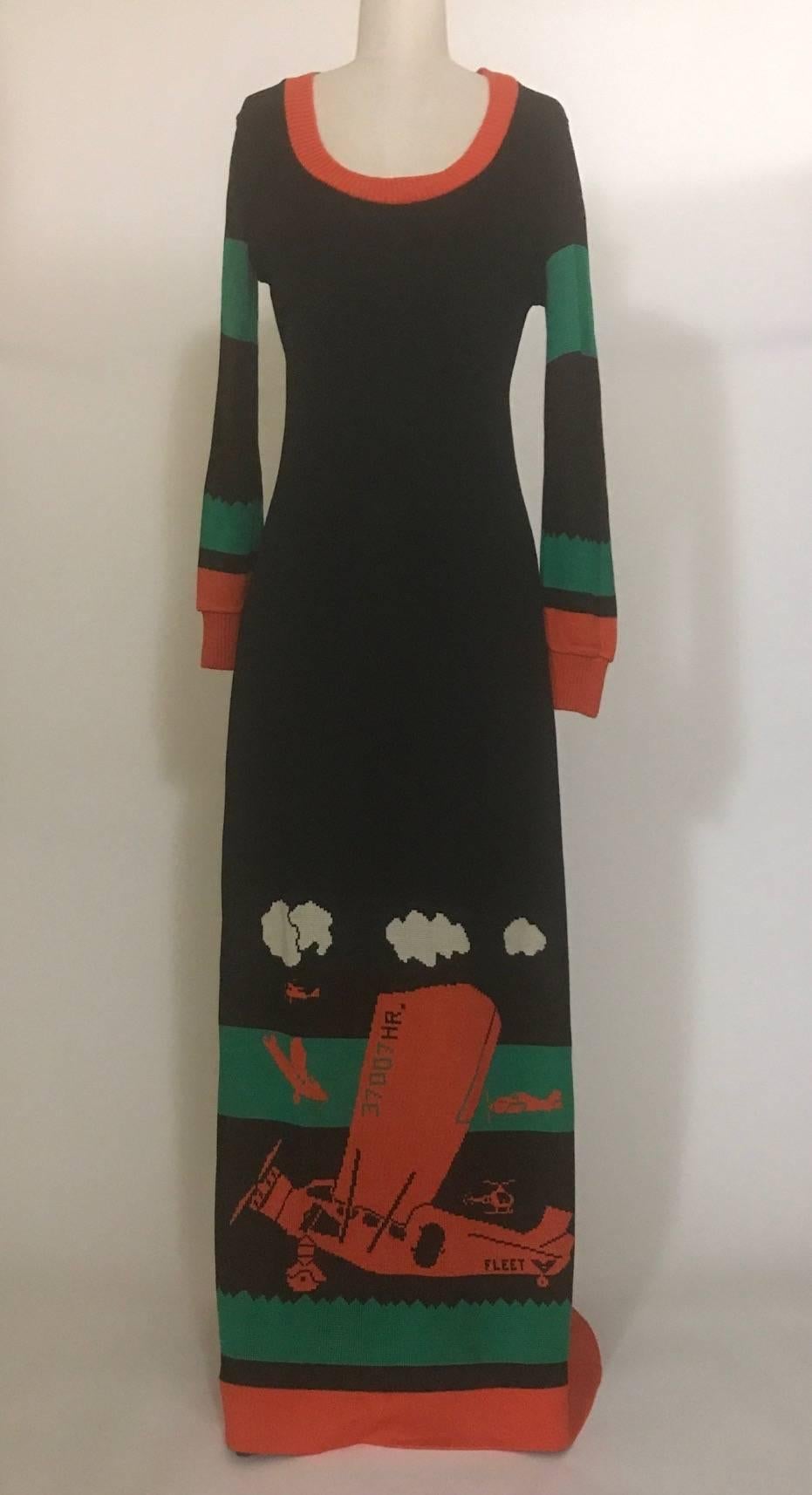 Vintage 1970s Sant'Angelo Knits for Saks Fifth Avenue sweater dress featuring Giorgio Sant'Angelo's iconic airplane design in a black, green, and red-orange intarsia double knit. 

No content tag, feels like acrylic.

No size tag. See measurements,