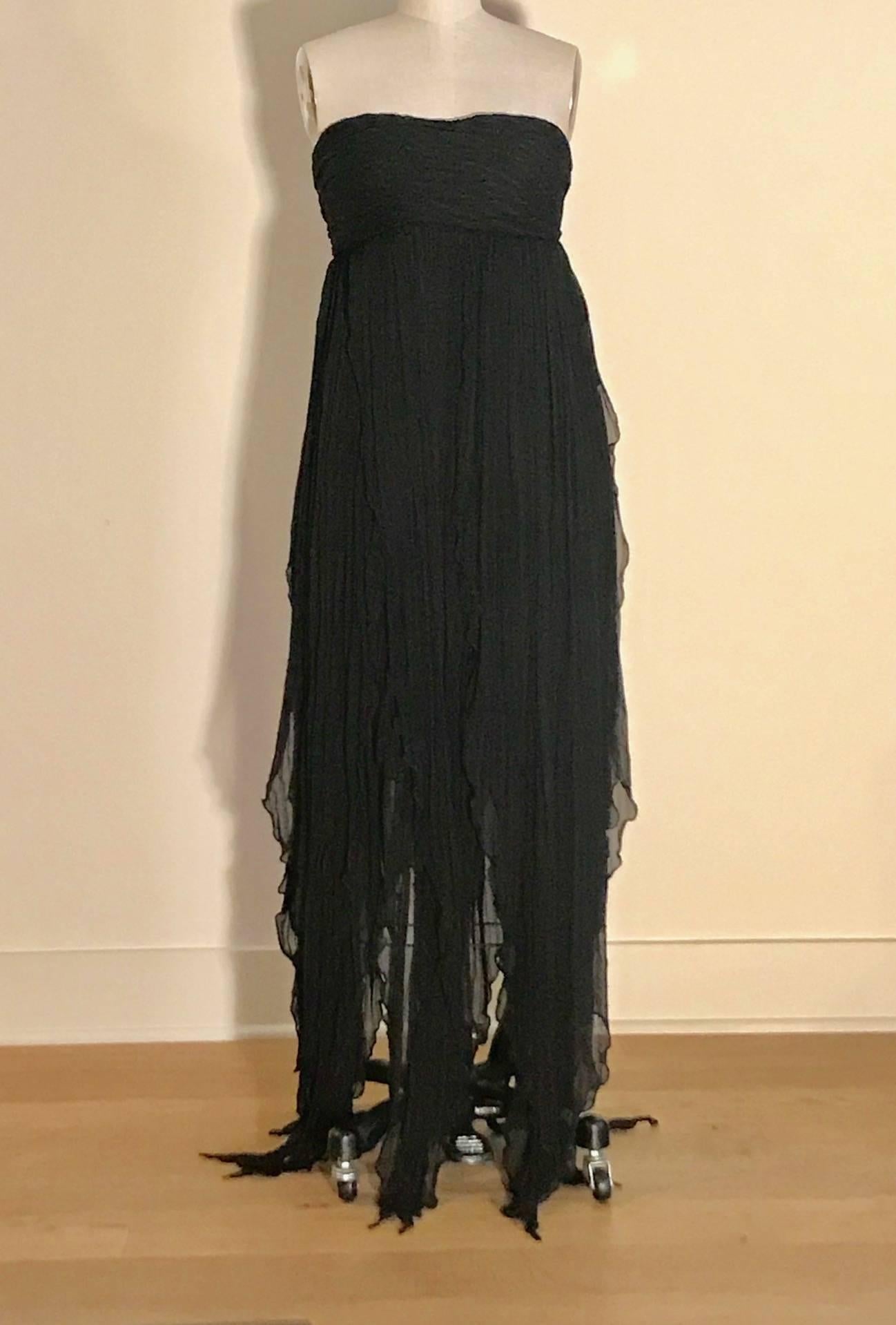 Alexander McQueen black on black stripe crinkled silk chiffon strapless dress. Soft pleats at bust, skirt hangs in separate strips/panels that create beautiful movement. Built in bustier at top. Fastens at back with two hook and eyes brassiere