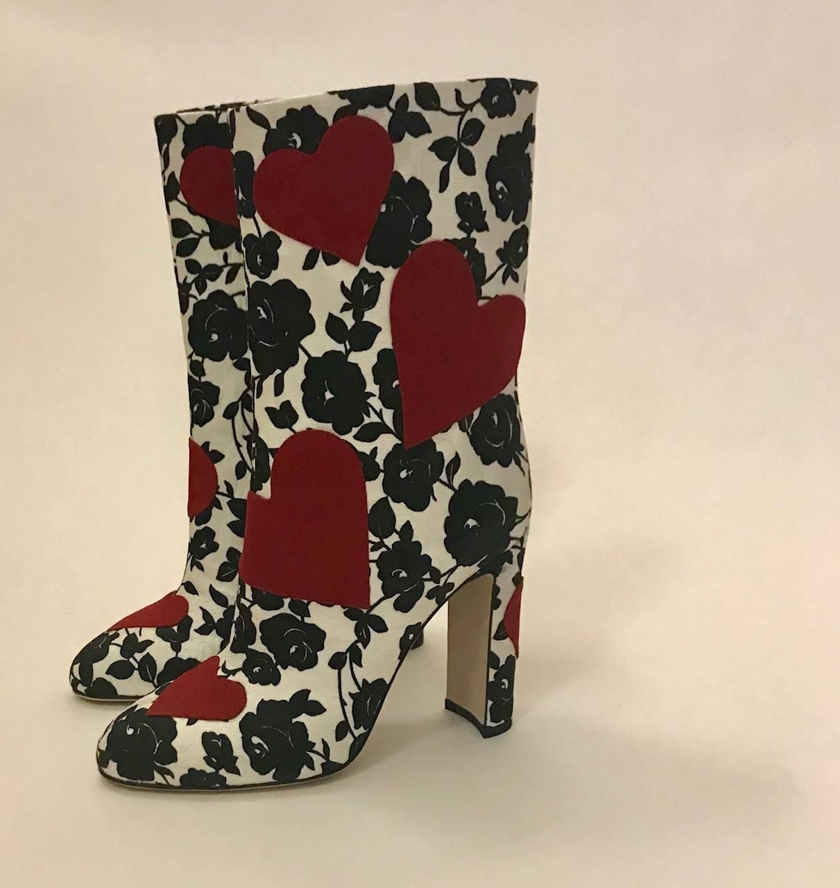 Dolce & Gabbana black and white rose print satin jacquard boots with red hearts. Covered heel, approximately 4 1/4 inches. Boot part is an additional 7 1/2