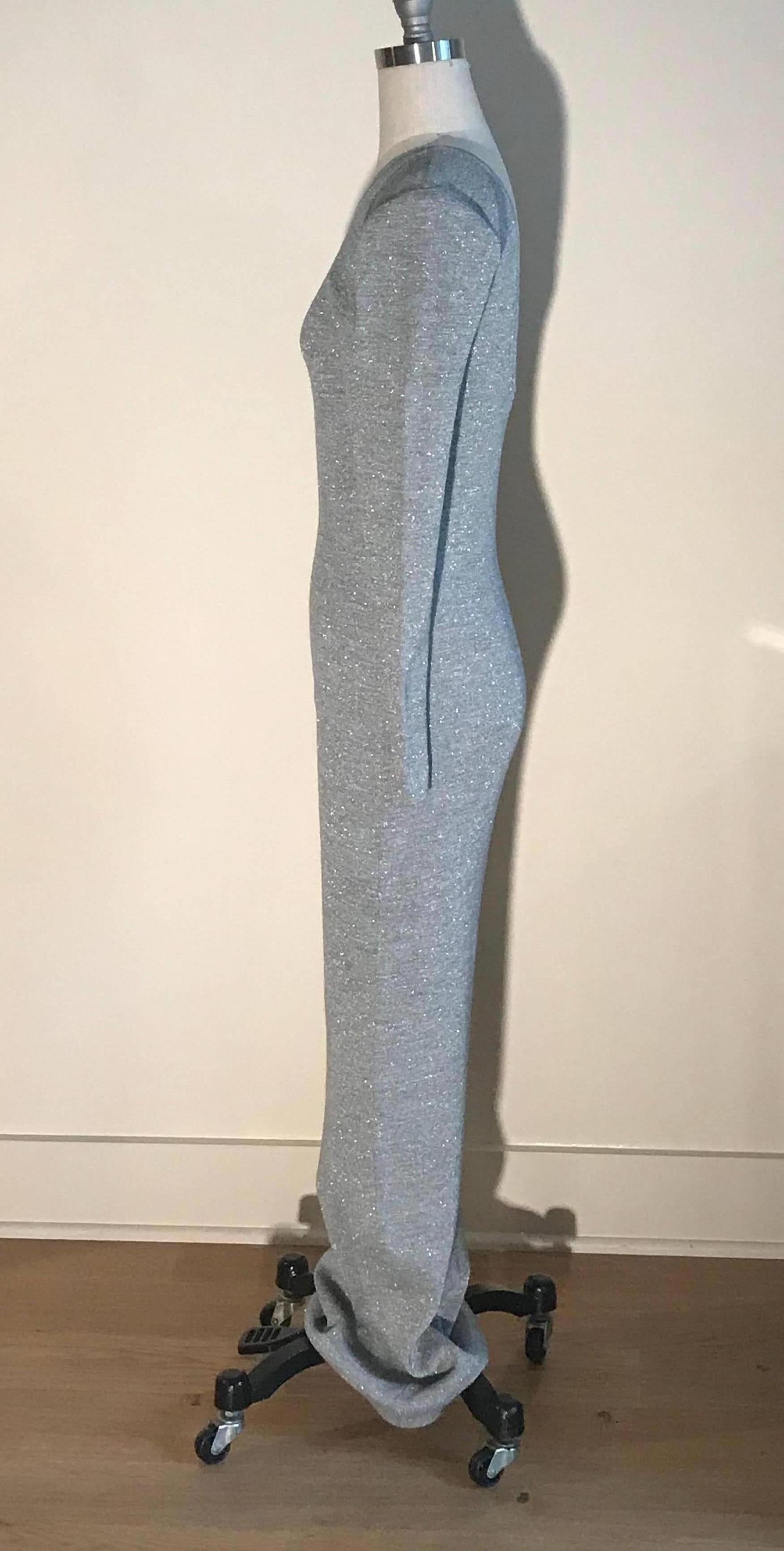 Patrick Kelly metallic silver grey thin rib knit maxi length sweater dress. Long sleeves and scoop back. Pull on. Light padding at shoulders. Purchased from an auction of items from the Atelier of Patrick Kelly.

Cotton unknown, feels like