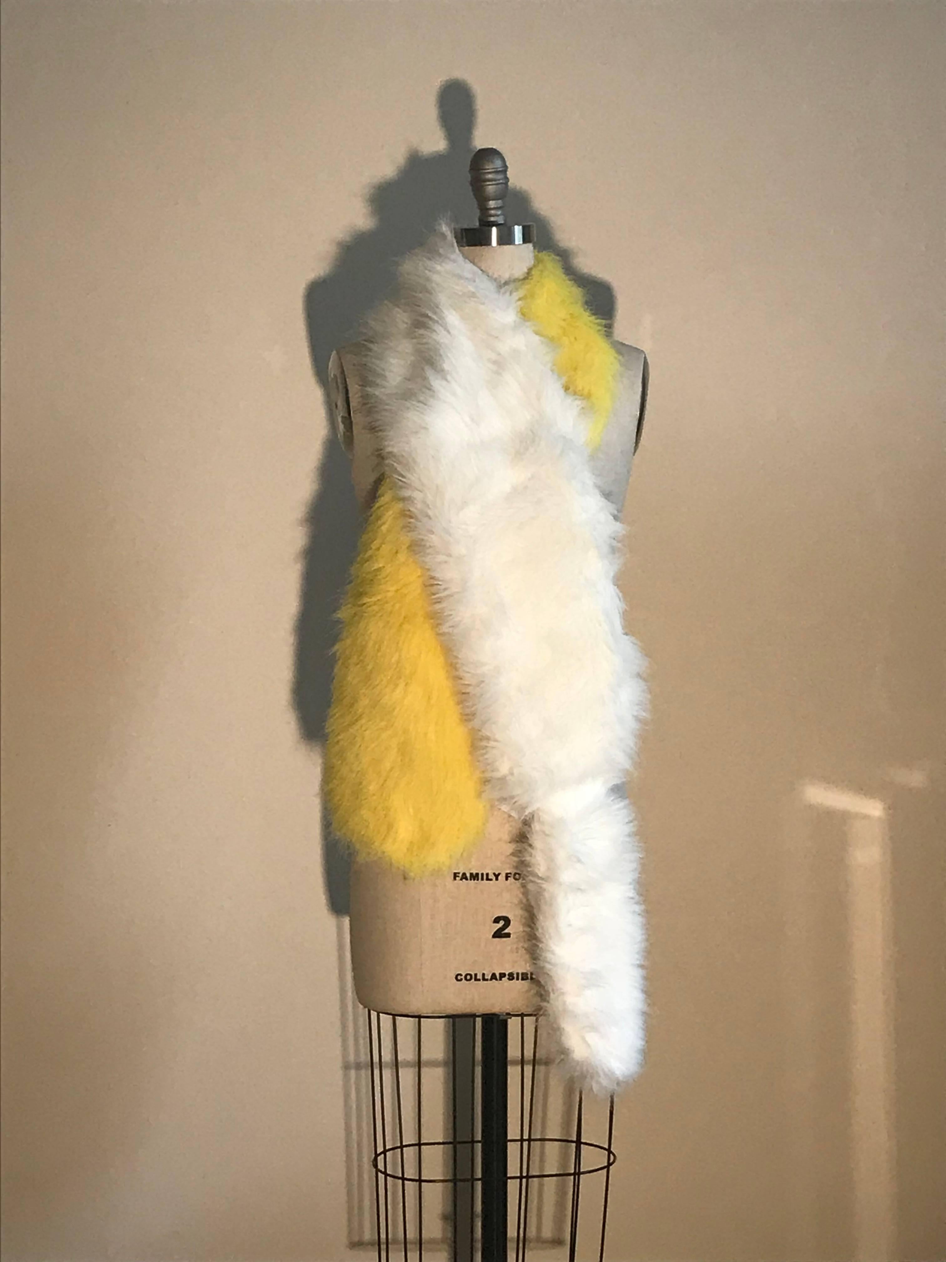 Prada yellow and white faux fur stole, as seen in the Spring Summer 2011 ad campaign and runway. Wear as is, or make it even more over the top by adding a cluster of pins or brooches. 

Made in Italy.

65% modacrylic, 35% acrylic on 100%