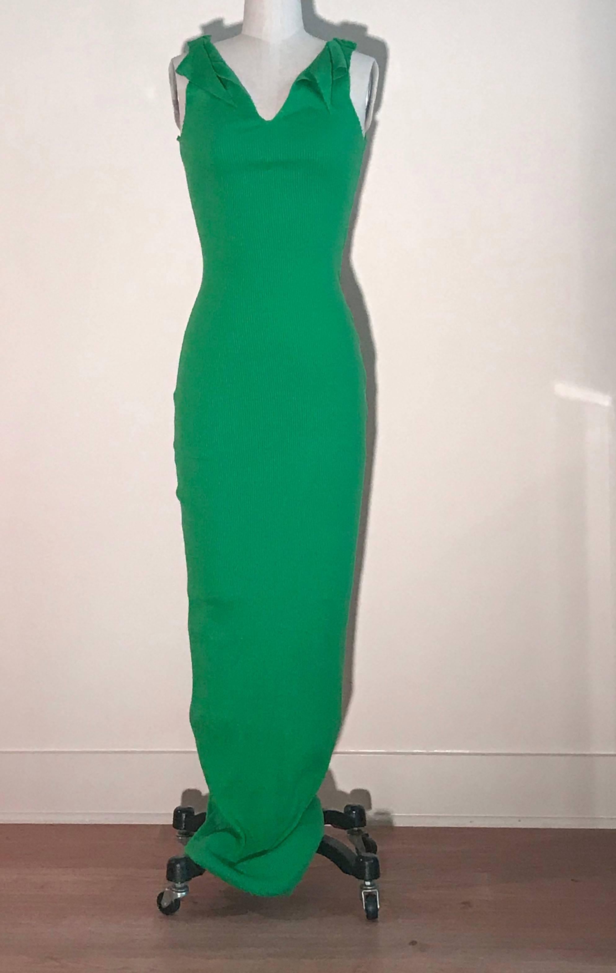 Patrick Kelly vintage 1980s long green rib knit dress with raw edge detail. Draped detail and exposed seam at shoulders, raw edge at back.  (We also have this dress available in red and blue.)

From an auction of the Atelier of Patrick Kelly.   

No