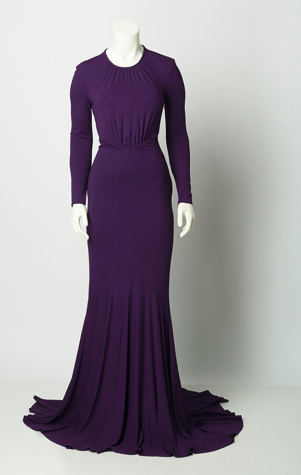 Michael Kors (mainline) purple stretch jersey fitted gown with flared hem. Slight train at back. Gathered at v-shaped waist seam. Cross-draped waist accent that probably accents front waist (we think we've photographed the dress with that part