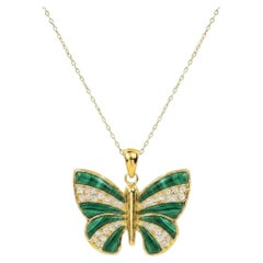 Colgante de mariposa chapado en oro de 18 quilates con turquesa, ónix negro, lapislázuli y malaquita
