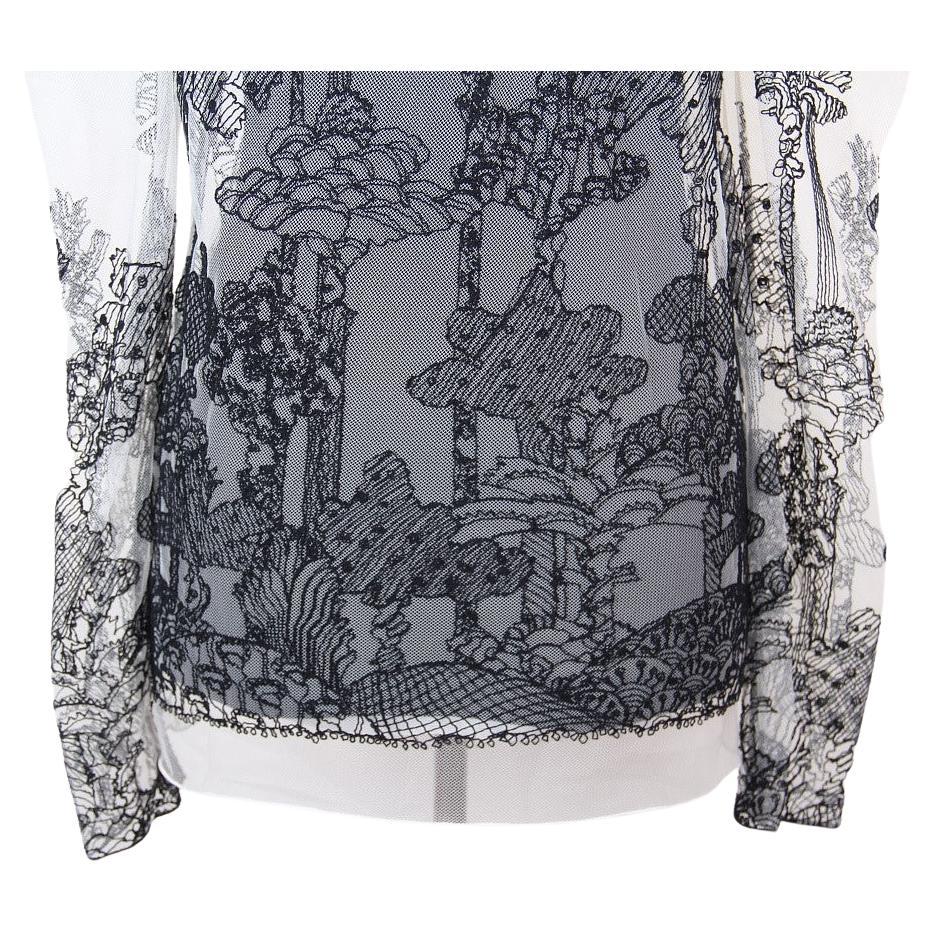 Chloe
Dreamscape Embroidered Tulle Top
Chloe by Clare Waight Keller 
Chloé sheer tulle top featuring Dreamscape embroidery.
From the Fall 2017 Ready-to-Wear Collection.
Georgette camisole underlay with lace trim.
Round neckline; keyhole back.
Puffed