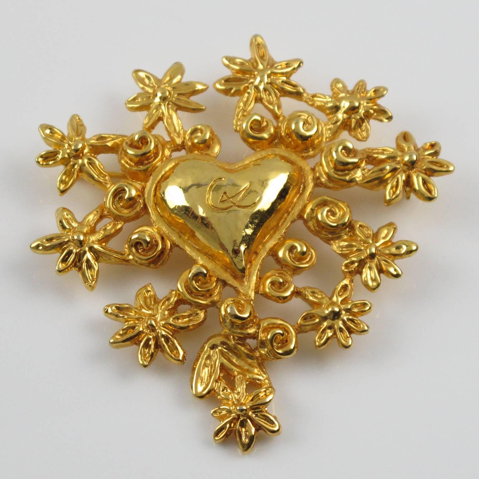 Vintage couture CHRISTIAN LACROIX Paris statement Pin Brooch. Fabulous gilt metal all carved and see thru shape, metal all textured featuring a large heart topped with "CL" logo and surrounded by stylized flowers. Excellent vintage