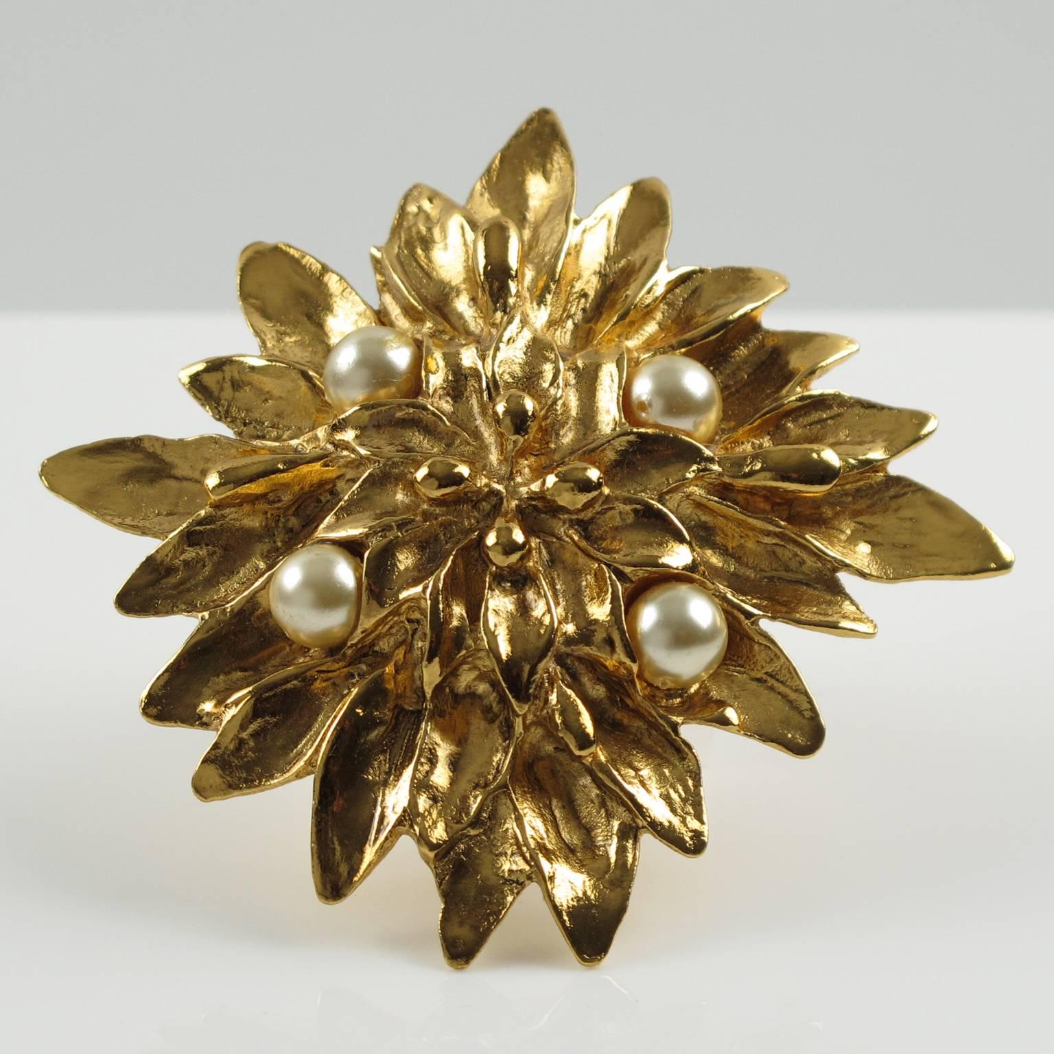 Vintage couture YVES SAINT LAURENT YSL Paris statement Pin Brooch. Lovely gold plate massive round shape, metal all textured featuring a large dimensional flower, ornate with four simulated pearl. Excellent vintage condition. Signed at the back