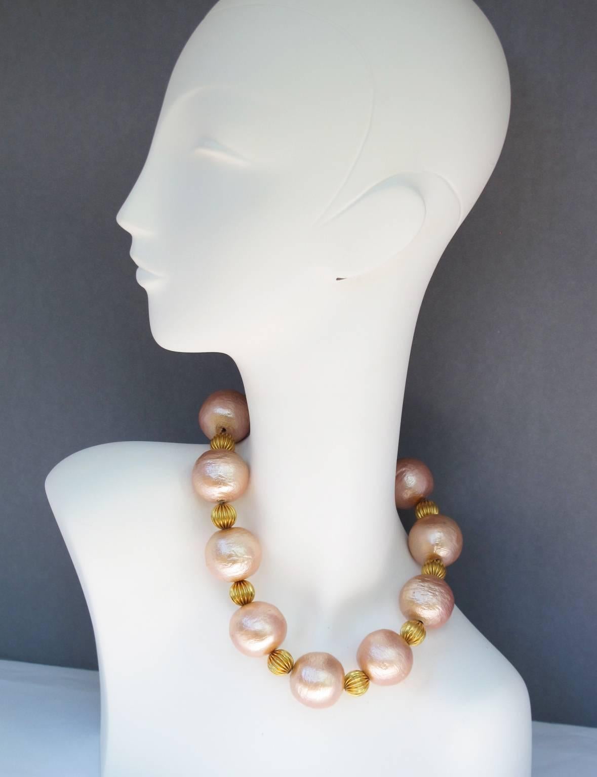 Rare GUY LAROCHE Paris signed couture choker Necklace. Elegant beaded design with huge resin beads in lovely powder pink color and with mother of pearl texture pattern compliment with gilt metal carved beads. The necklace hangs very nicely around