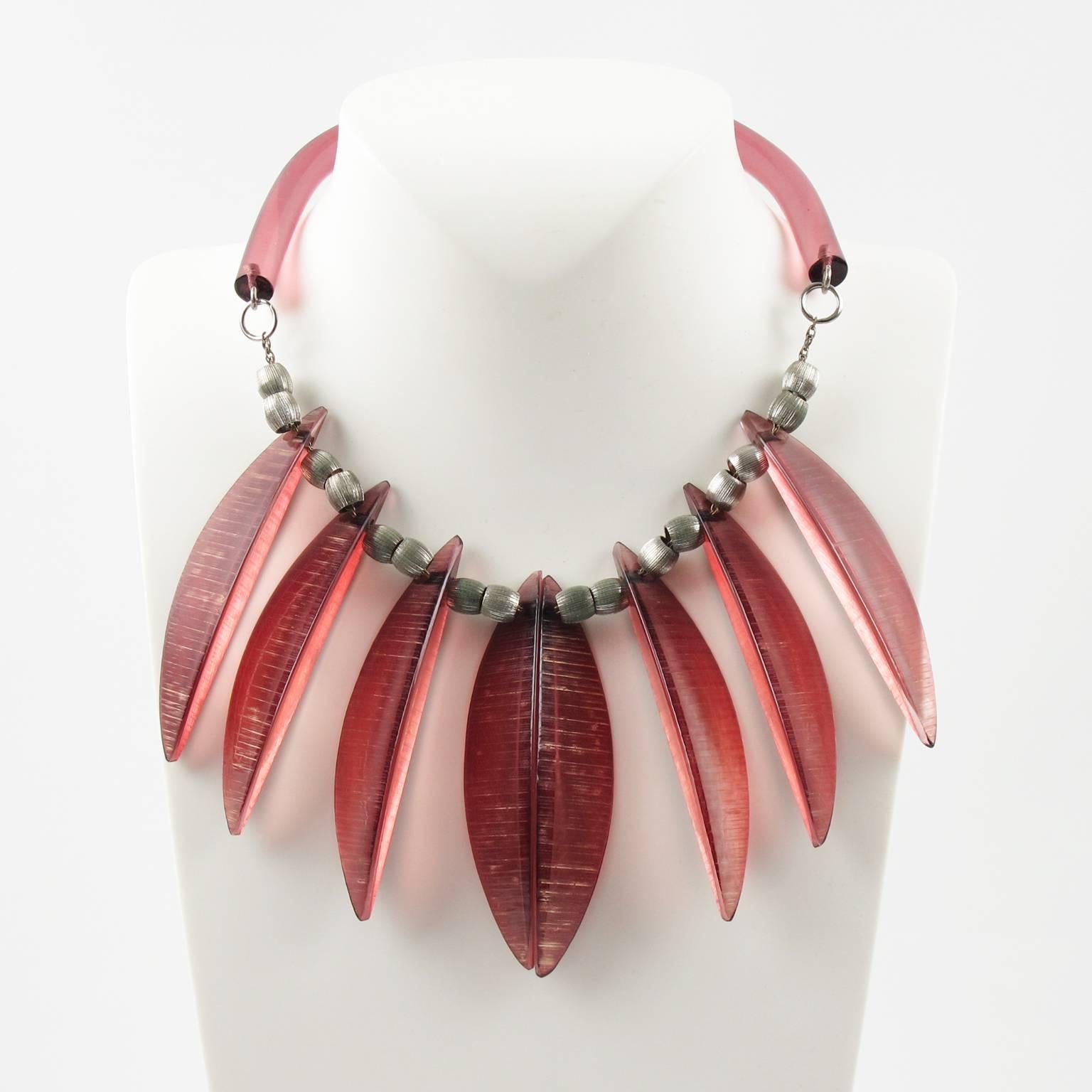 Fabulous vintage stunning piece of art by Judith Hendler. This necklace is from the 80's. It has the iconic acrylic - lucite neck tube ring and from it are the fabulous feather-like acri-gems hanging from silver plate twisted chain. The feathers are