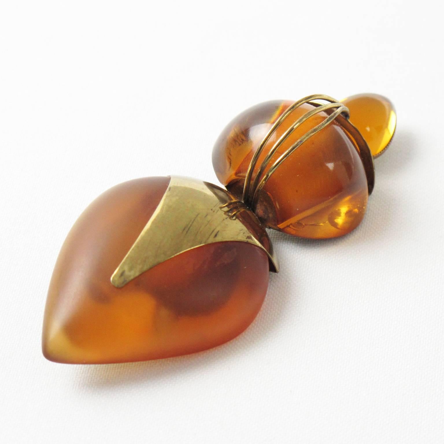 Vintage Fabrice Paris signed Pin Brooch. Elegant 1980s dimensional geometric piece with Art Deco inspired feeling. Elongated shape with gilded brass, transparent and frosted honey amber resin and topped with honey amber poured glass cabochon. Signed