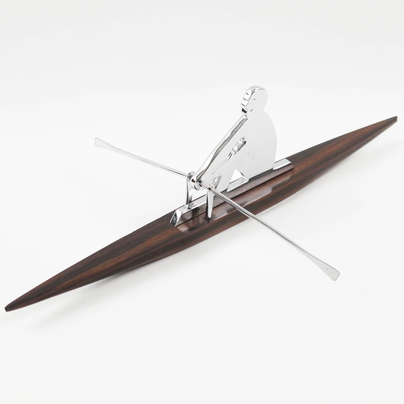 Unusual vintage French Art Deco elegant sculpture model. Featuring a curiosity rower with boat in Macassar wood, chrome-plated flat sport figurine and oars. Stamped 