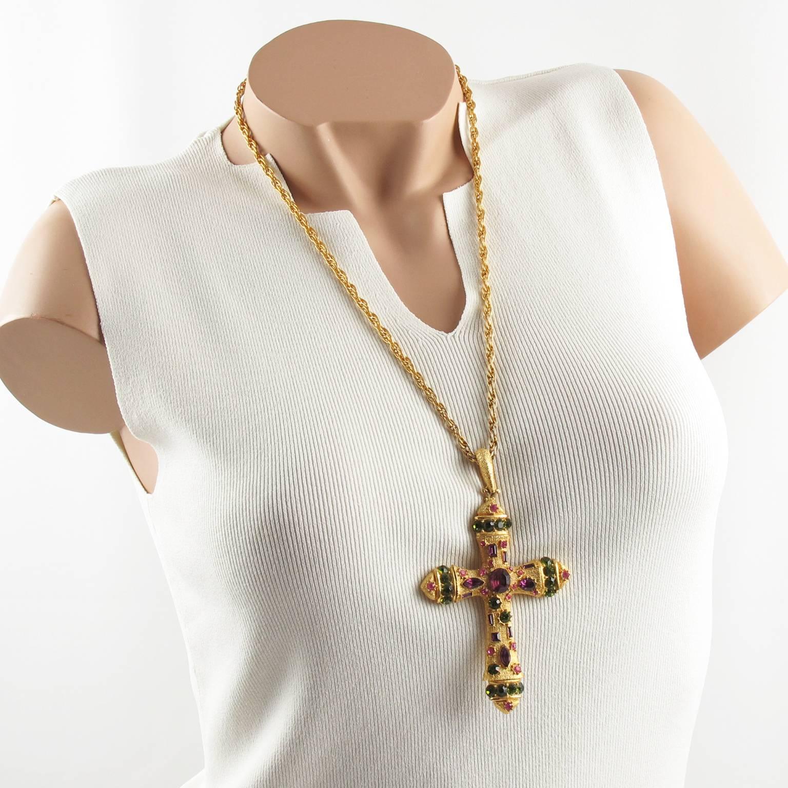 Massive gilt metal cross pendant necklace. Featuring a huge dimensional modernist cross pendant, all ornate with glass cut rhinestones in purple grape, olive green and blush pink color. Original long and heavy twisted gilt metal chain with spring