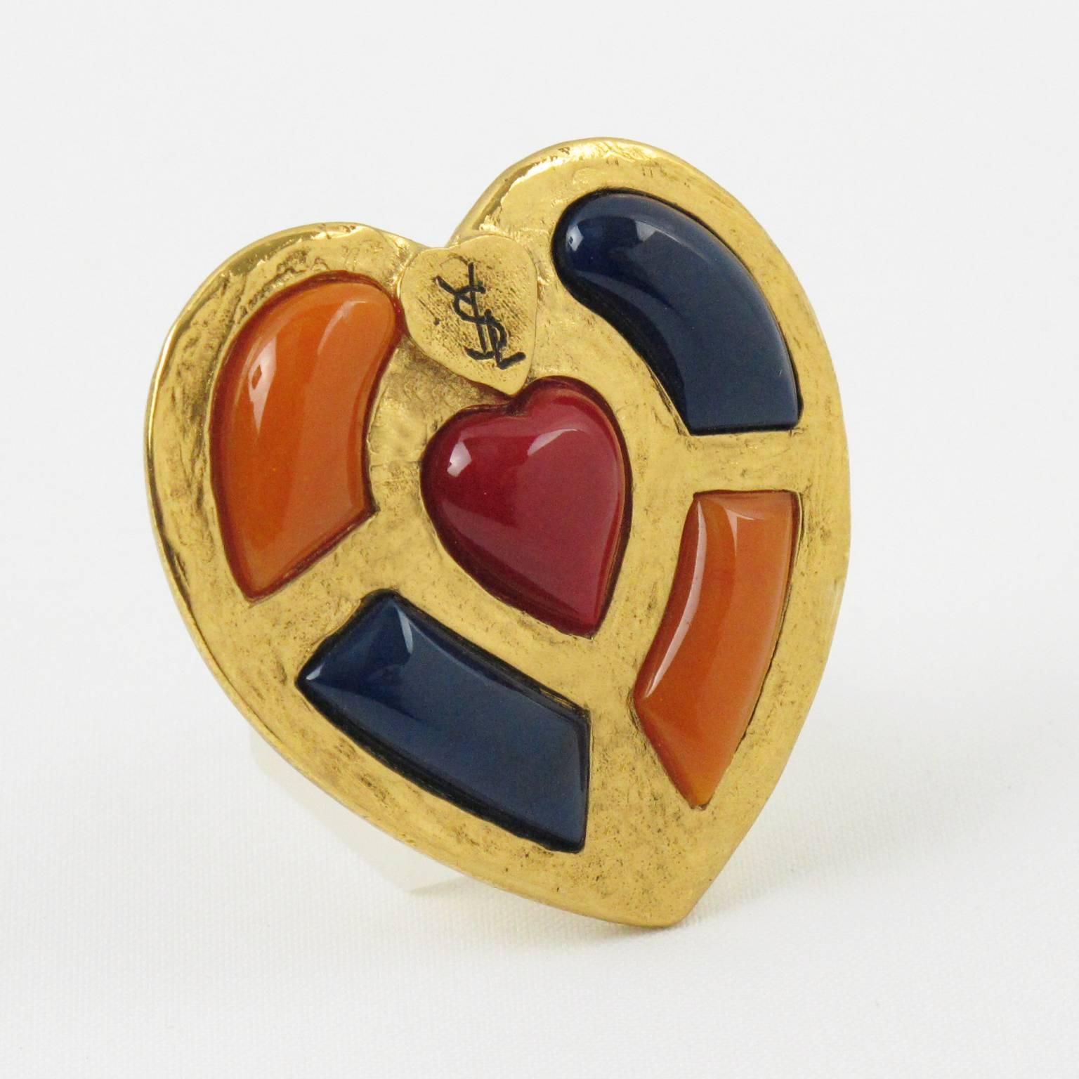 Elegant vintage YVES SAINT LAURENT YSL Paris couture Pin Brooch Pendant. Fabulous gilt metal massive heart shape, metal all textured with hand made feel, ornate with large domed resin cabochons in assorted tones of blue, orange and red. Security