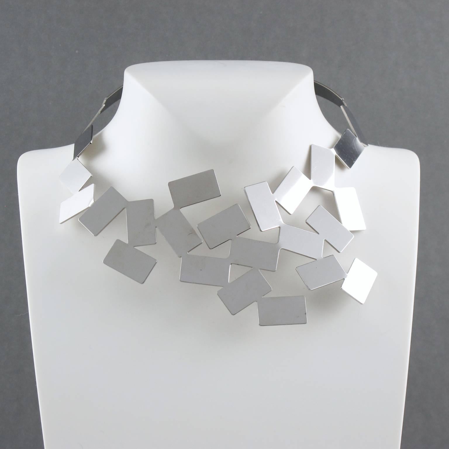 This stunning, modern collar necklace designed by Mario Trimarchi for Alessi is a real statement piece for any formal occasion. In vibrant stainless steel with polished mirrored surface, the cubic design looks sleek and stylish. Marked at the back: