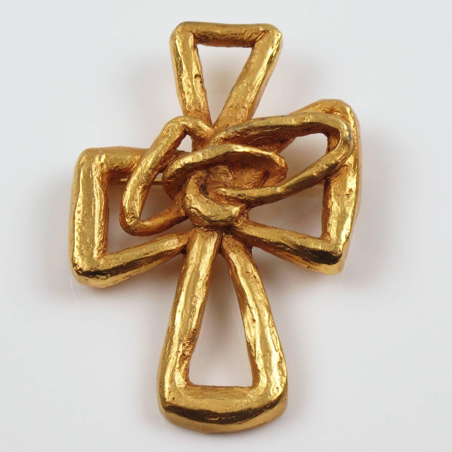 Vintage CHRISTIAN LACROIX Paris signed Pin Brooch. Lovely gilt metal all carved, pierced and see thru shape, metal all textured with satin finish aspect featuring a large cross. Signed at the back 