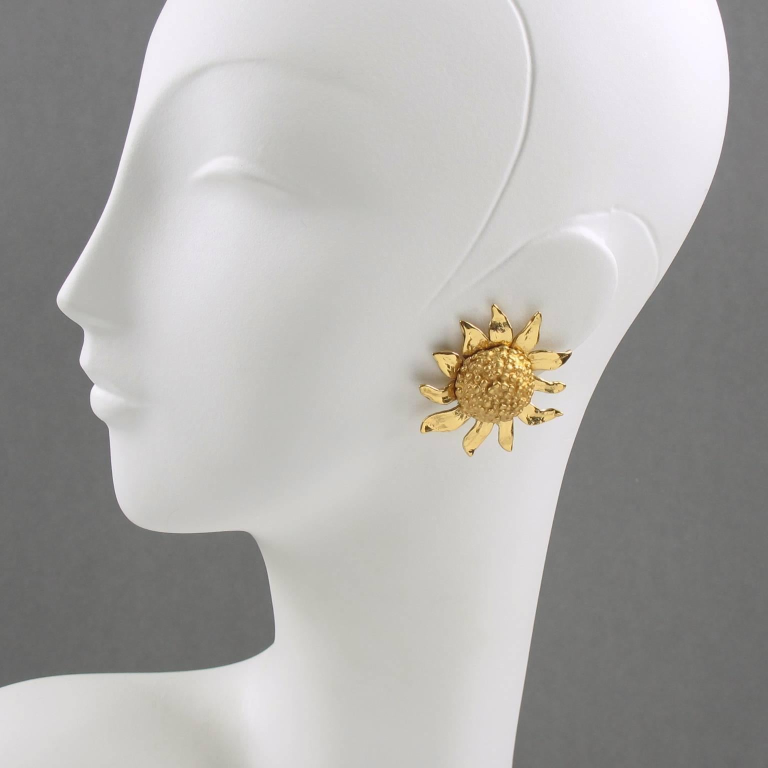 Lovely 1980s Yves Saint Laurent YSL Paris signed clip on earrings. Oversized dimensional elegant sunflower, gilt metal all textured and carved. Engraved on clasp 