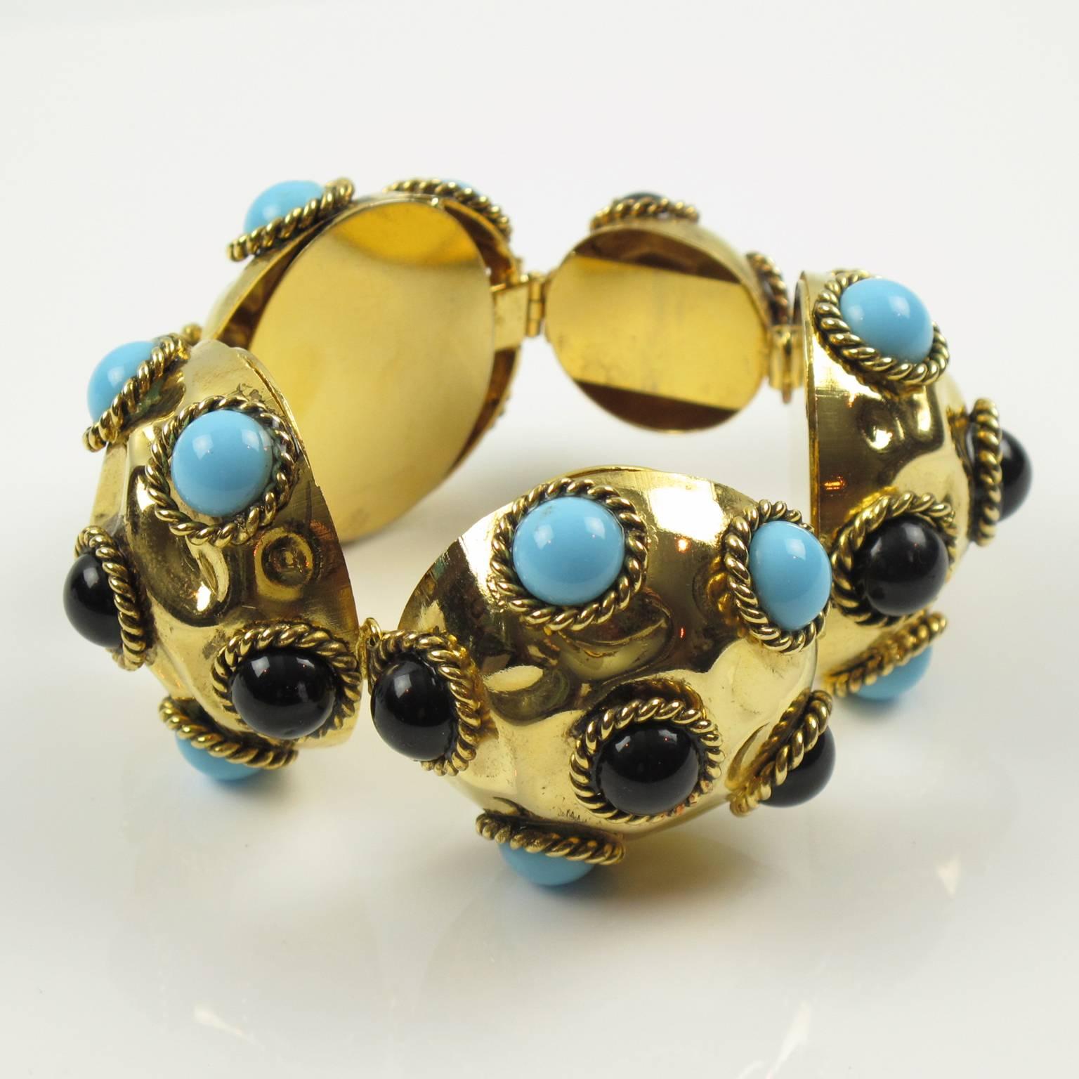 Elegant French Artisan designer jeweled link bracelet. Featuring large gilt metal domed elements topped with dark red resin cabochons and poured glass cabochons in imitation turquoise stone. Locking box clasp working great. No visible marking.