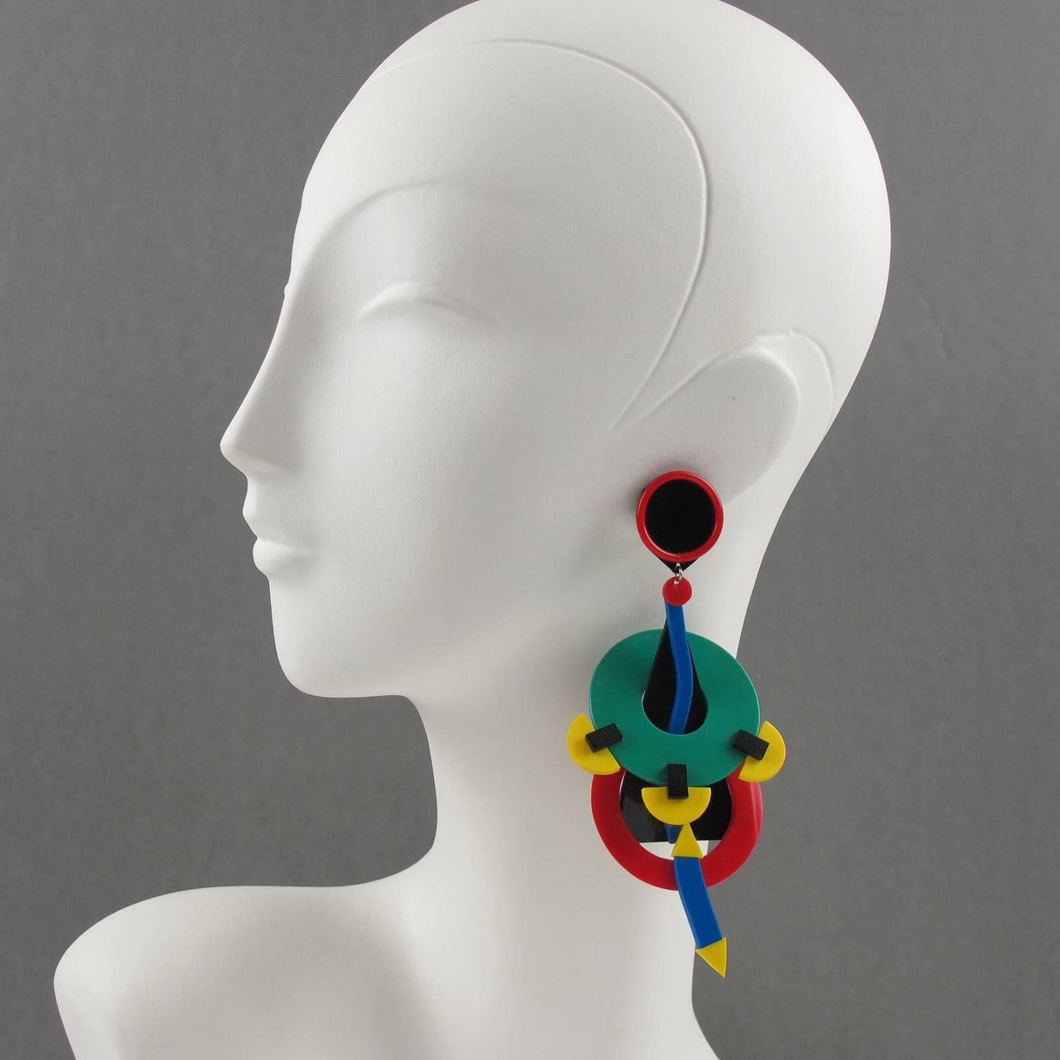 Rare vintage Italian designer Memphis Studio oversized clip on earrings. Featuring colored rubber in geometric and asymmetric carved shape. Lovely chandelier shape with dangling design. Assorted colors of black, red, yellow, green, orange and