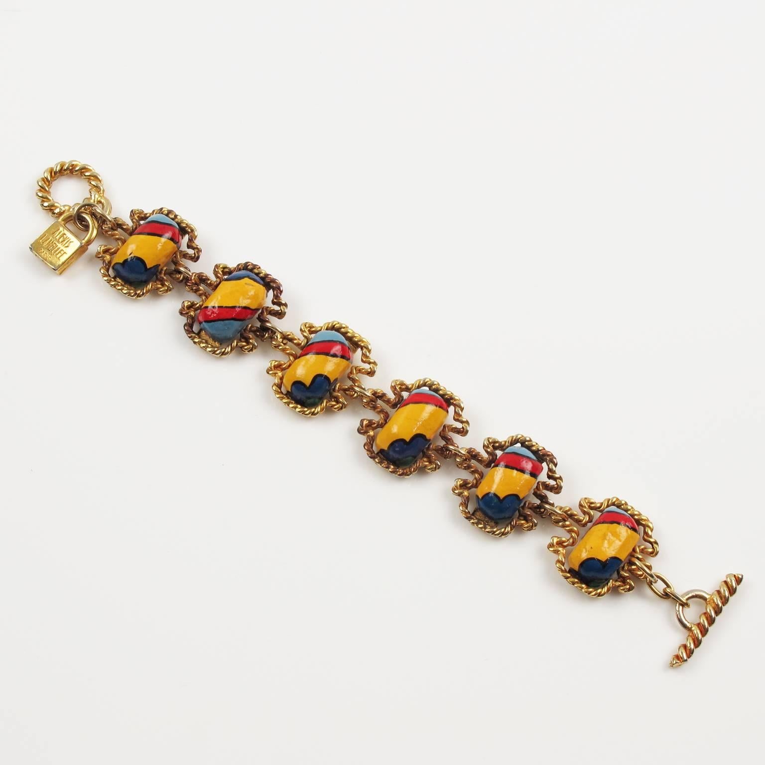 Rare vintage French designer Alexis Lahellec Paris signed link Bracelet. Unusual modernist design with gilt metal frame topped with resin cabochon, in an hand-made feel pattern and colorful assorted tones of yellow, red, navy blue and light blue.