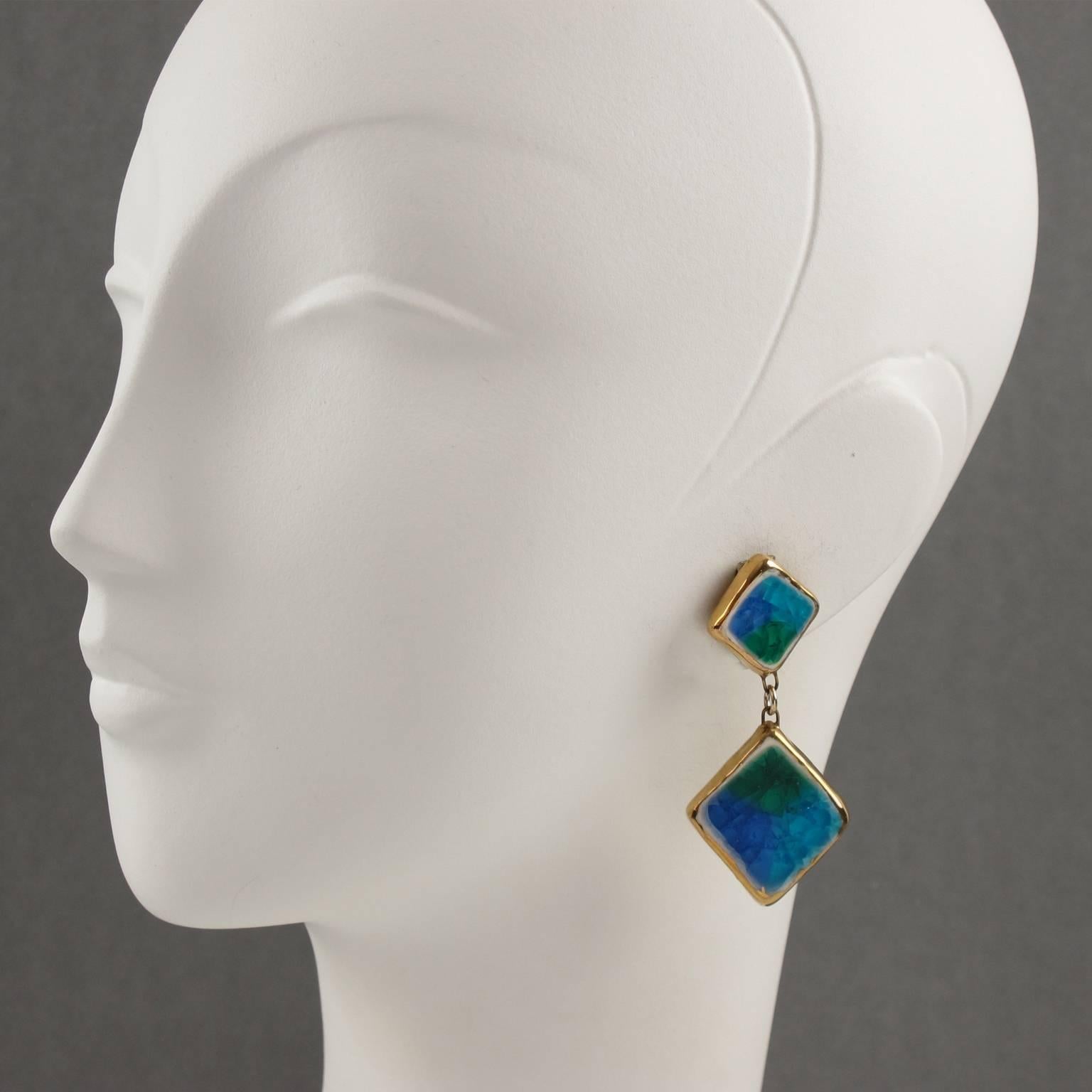 Rare Italian Mid-Century Modern clip on earrings. Featuring rectangular ceramic elements, dangling shape, with gilt enamel and gorgeous blue, turquoise and green glaze, topped with fused crackled glass. Typical Italian ceramic work of the 1960s,