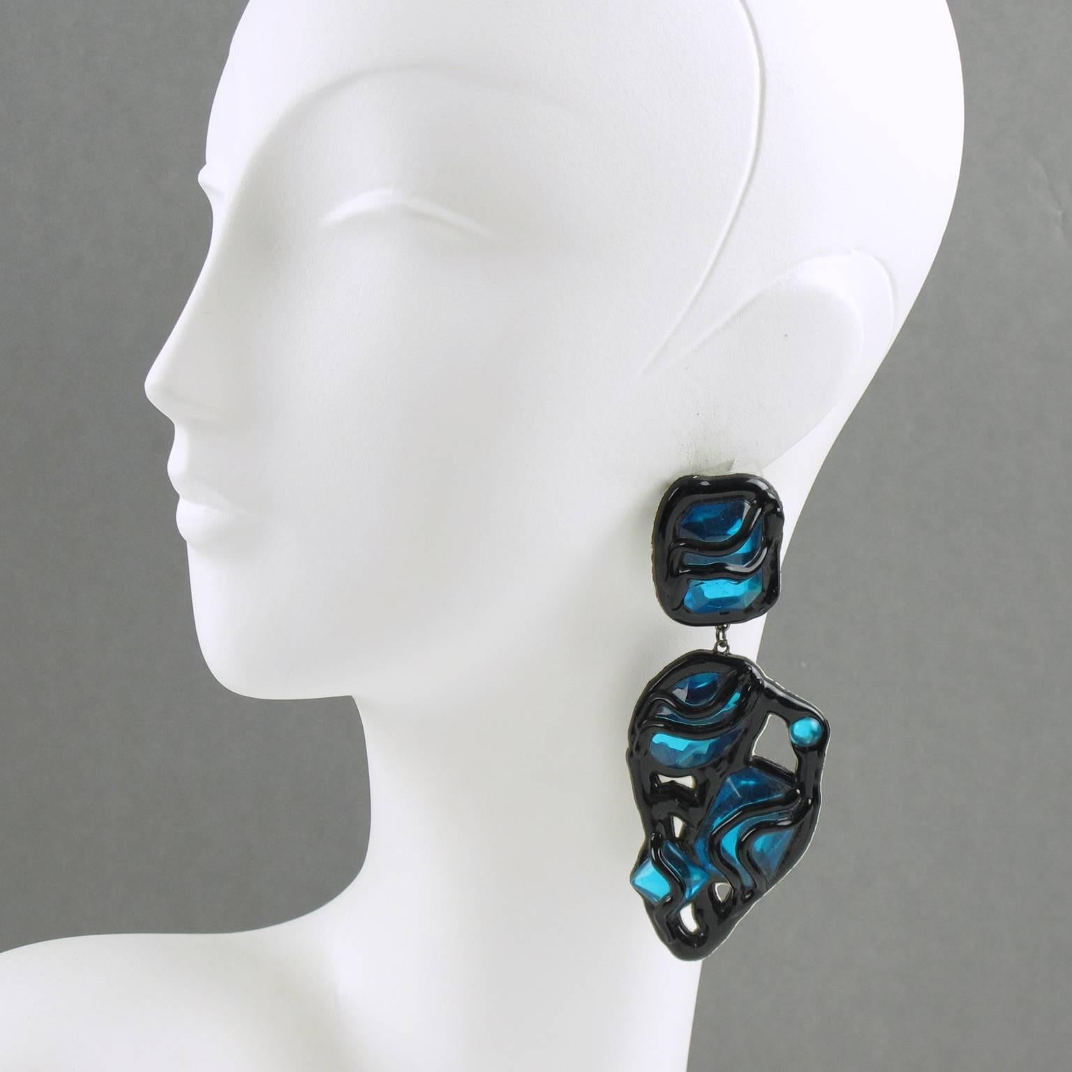 Fabulous artisan designer oversized dangling earrings. Brutalist design with chandelier shape, black Lucite in free-form carved and pierced compliment with large electric blue Lucite rhinestones, in assorted carved shape. For pierced ears. Excellent