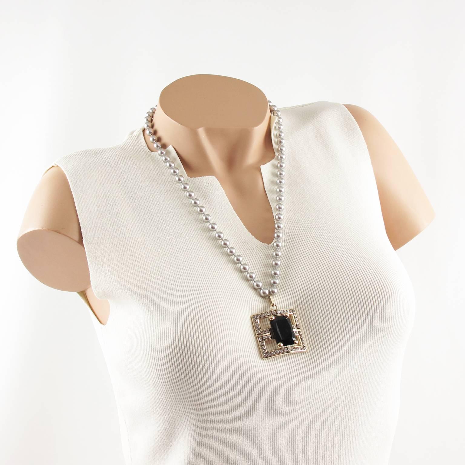 Stunning Valentino Garavani couture necklace. Long one strand of pearl-like beads compliment with geometric pendant medallion covered with rhinestones. The faux pearls have a lovely shimmery gray color. Central pendant is made of silvered metal