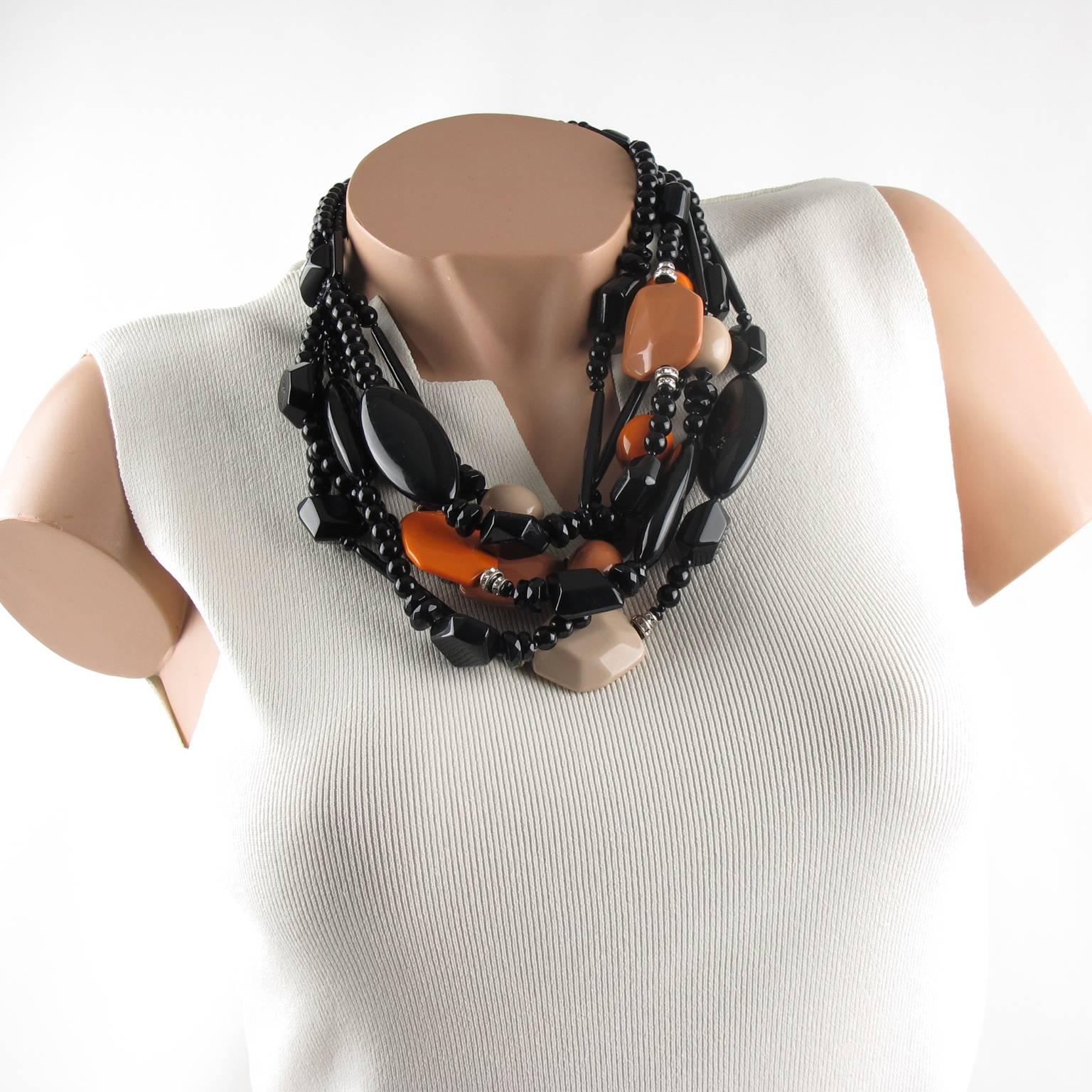 Superb Angela Caputi, made in Italy resin choker beaded necklace. Oversized fruit salad multi-strand design with dominant black color contrasted with carrot orange, beige hazel wood and apple cider resin pebbles beads, compliment with clear