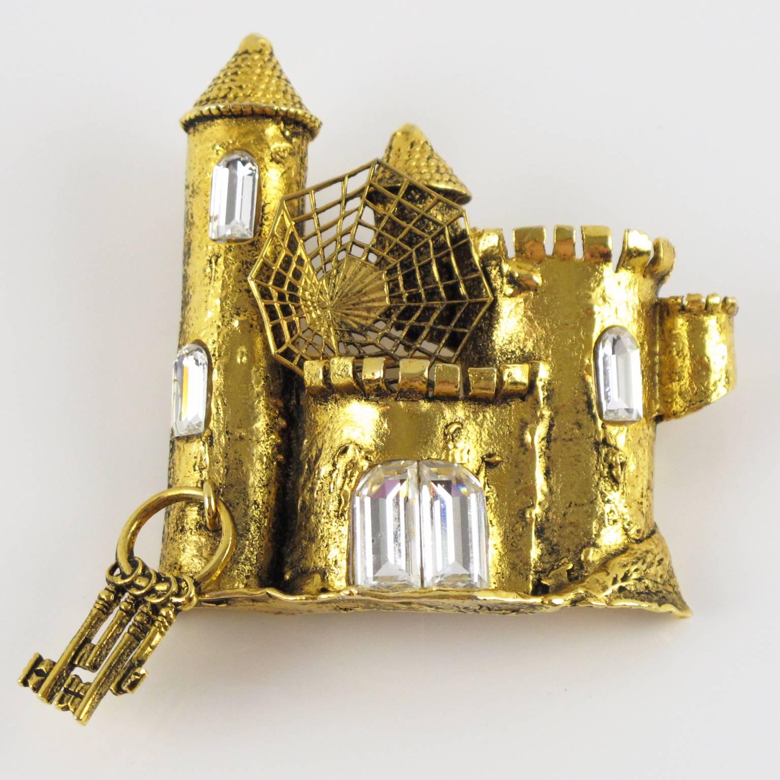 Vintage signed MERCEDES ROBIROSA Paris couture Pin Brooch. Fabulous fantasy style with gilt metal all textured and pierced, figuring an haunted castle with spider web and dangling charm set of keys, ornate with large square shaped clear rhinestones.