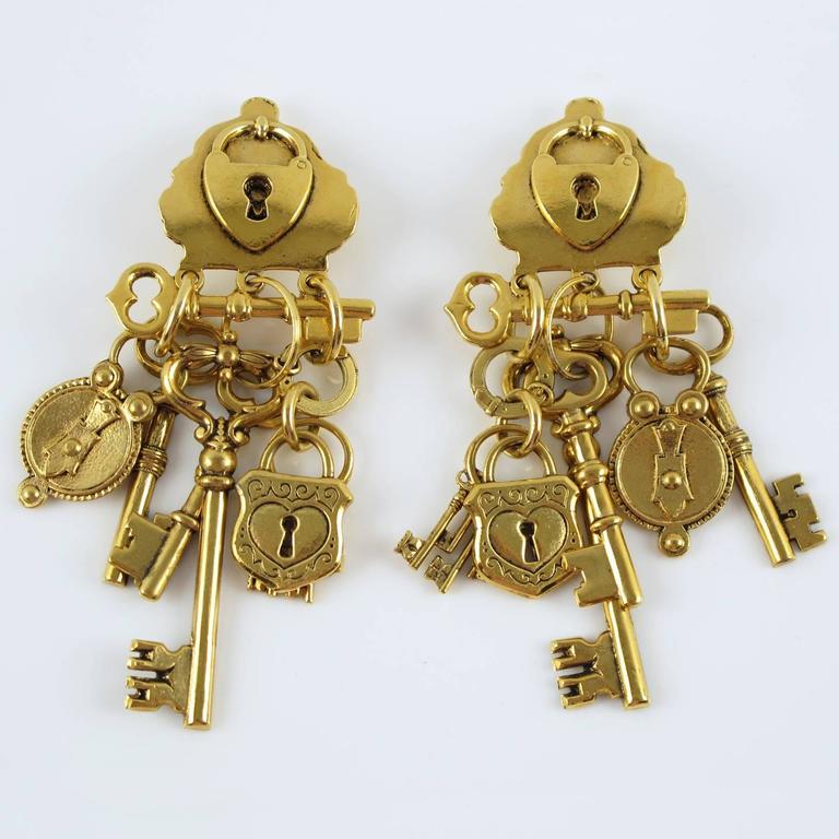 Zoe Coste Paris dramatic gilt metal dangling Earrings at 1stDibs zoe