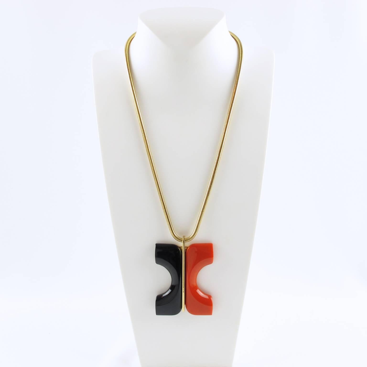 Rare Lanvin couture necklace. Vintage piece from the early 1970s featuring an oversized modernist pendant with architectural dimensional shape in black and orange tones. Original gilt metal snake chain. Lanvin Paris gilt tag attached to clasp. In