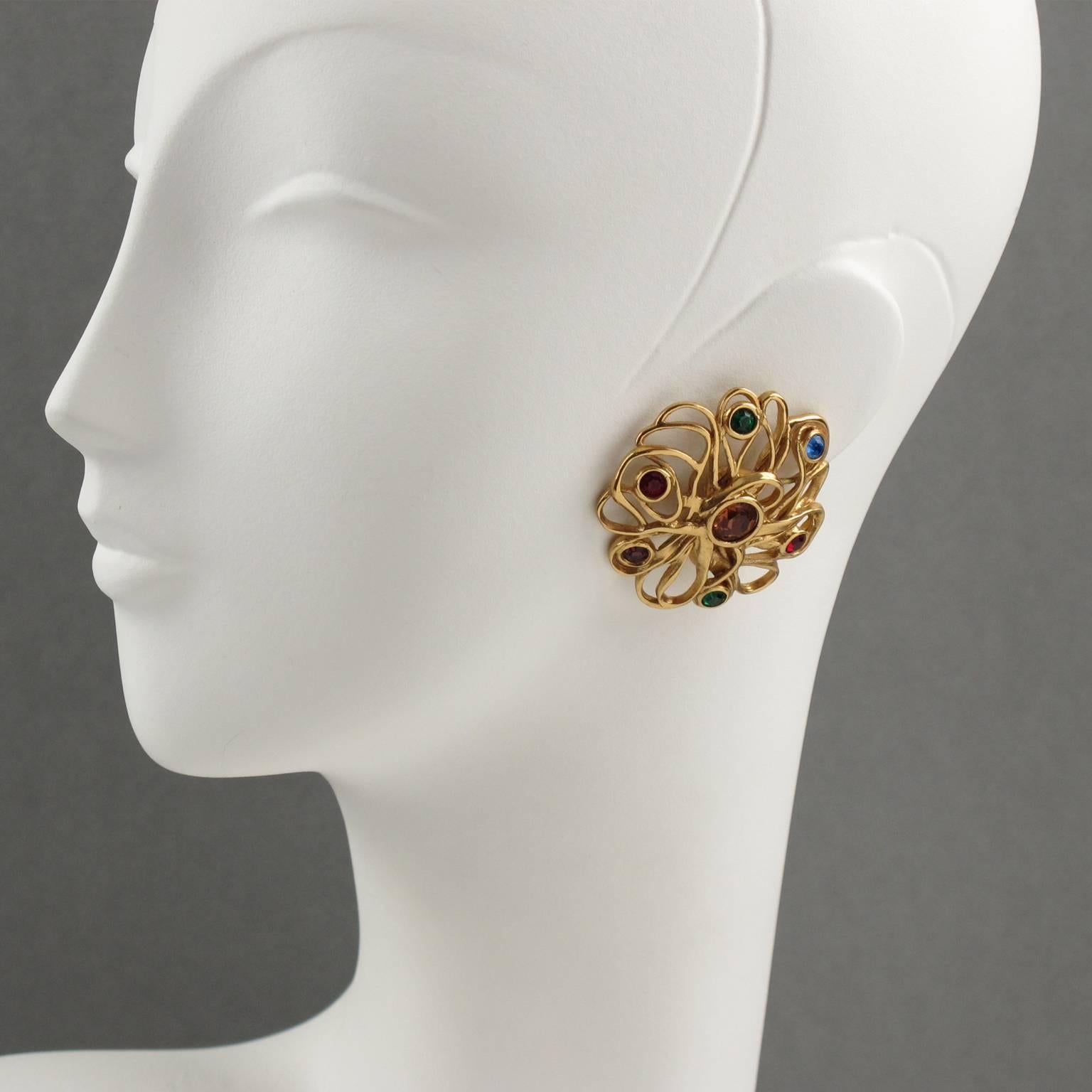 Stunning Yves Saint Laurent YSL Paris signed clip on Earrings. Lovely gilt metal large round shape, metal all textured and pierced featuring sort of lace, ornate with large central burnt orange rhinestone and topped with tiny green, purple, red,