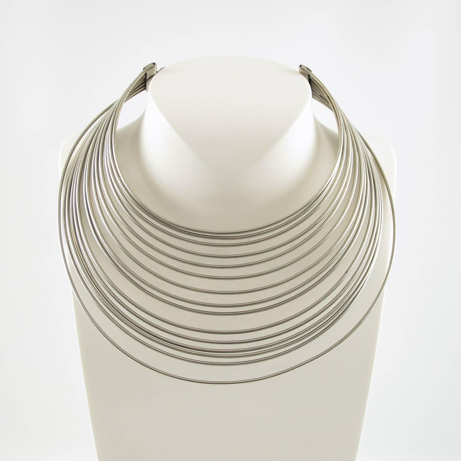 Rare silvered metal collar necklace by French couture designer Jean Paul Gaultier. Very interesting rigid multi-strand design from the 1997 Masai collection inspired by African popular jewelry. Marked 'Gaultier' at the back. Link chain gives