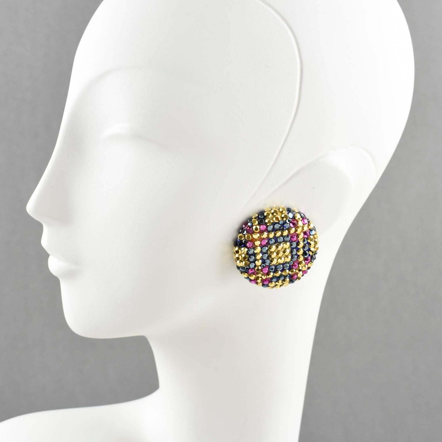 Elegant pair of impressive statement clip-on earrings designed by Richard Kerr in the 1980s. They are made up of his signature pave rhinestones. Featuring large round flat shape all covered with couture color crystal rhinestones in a tweed design on