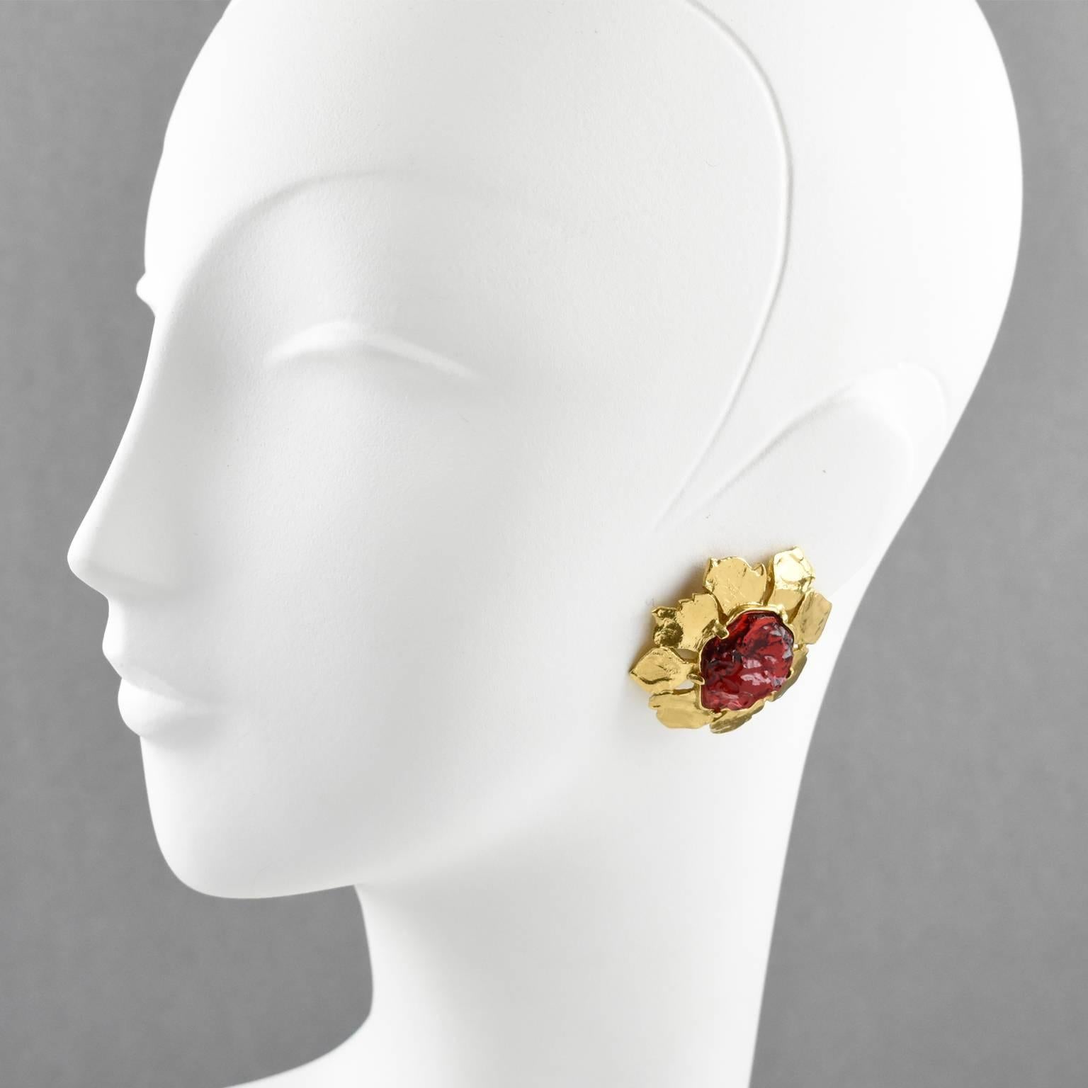 Romantic Yves Saint Laurent YSL Paris clip-on earrings. Elegant gilt metal floral shape, metal all textured with hand-made feel compliment with ruby red textured resin cabochon rhinestone. Signed at the back 'YSL Made in France'. 
Measurements: 1.69