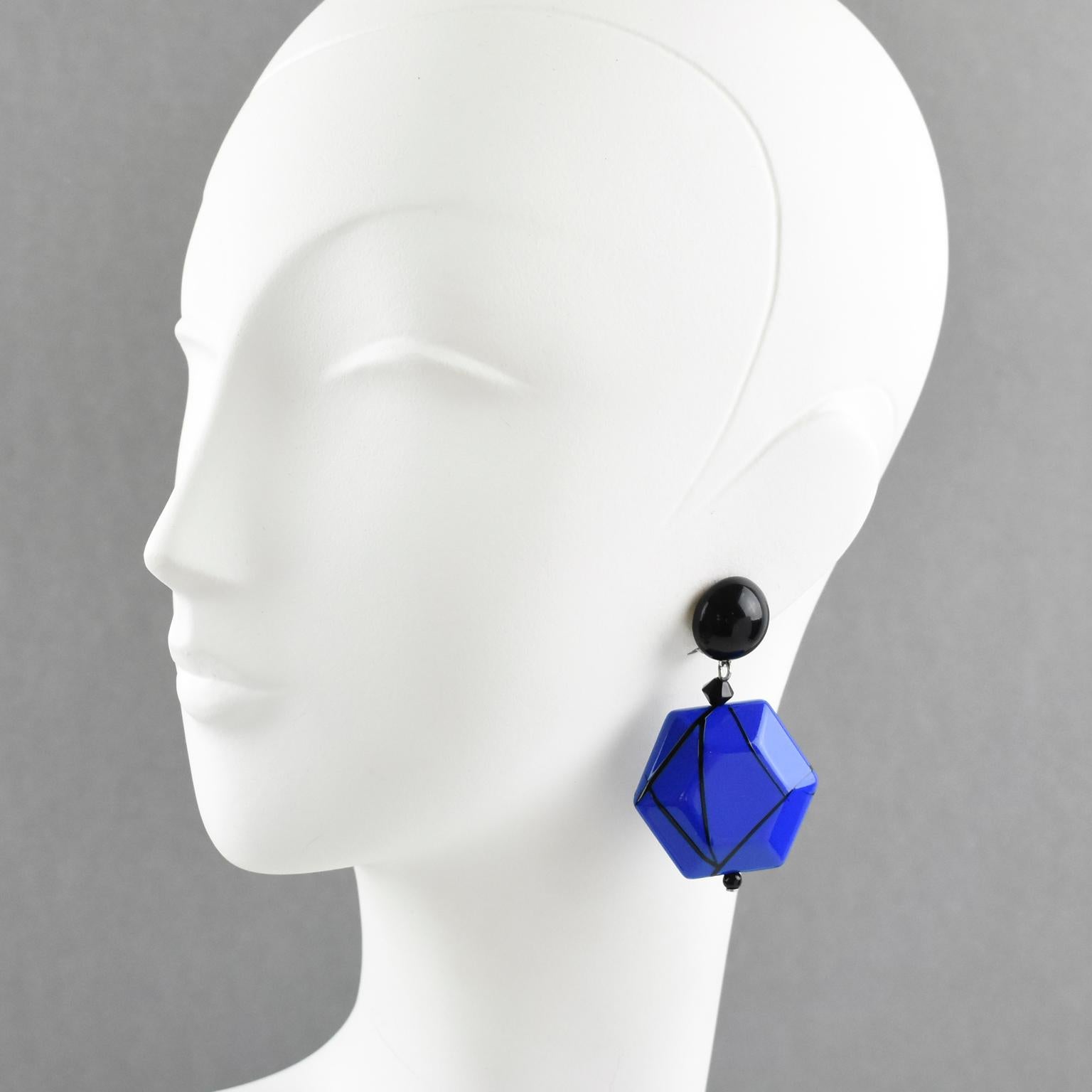 Very chic Angela Caputi, made in Italy resin clip on earrings. Dangling shape with black color contrasted with electric blue resin geometric pebble bead all wrapped around with black lines. Her matching of colors is always extremely classy, perfect