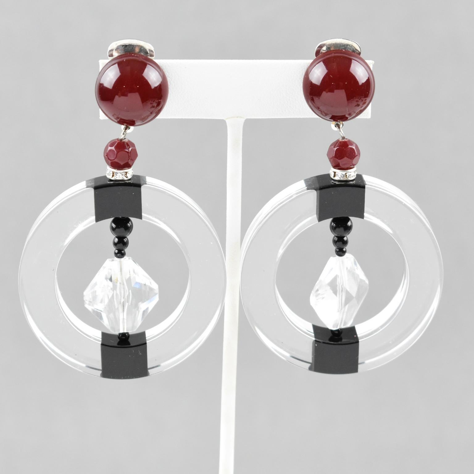 Stunning Angela Caputi, made in Italy resin clip on earrings. Oversized dangling design with large crystal clear hoop ornate with black and burgundy red elements and topped with clear rhinestones spacer ring. Her matching of colors is always