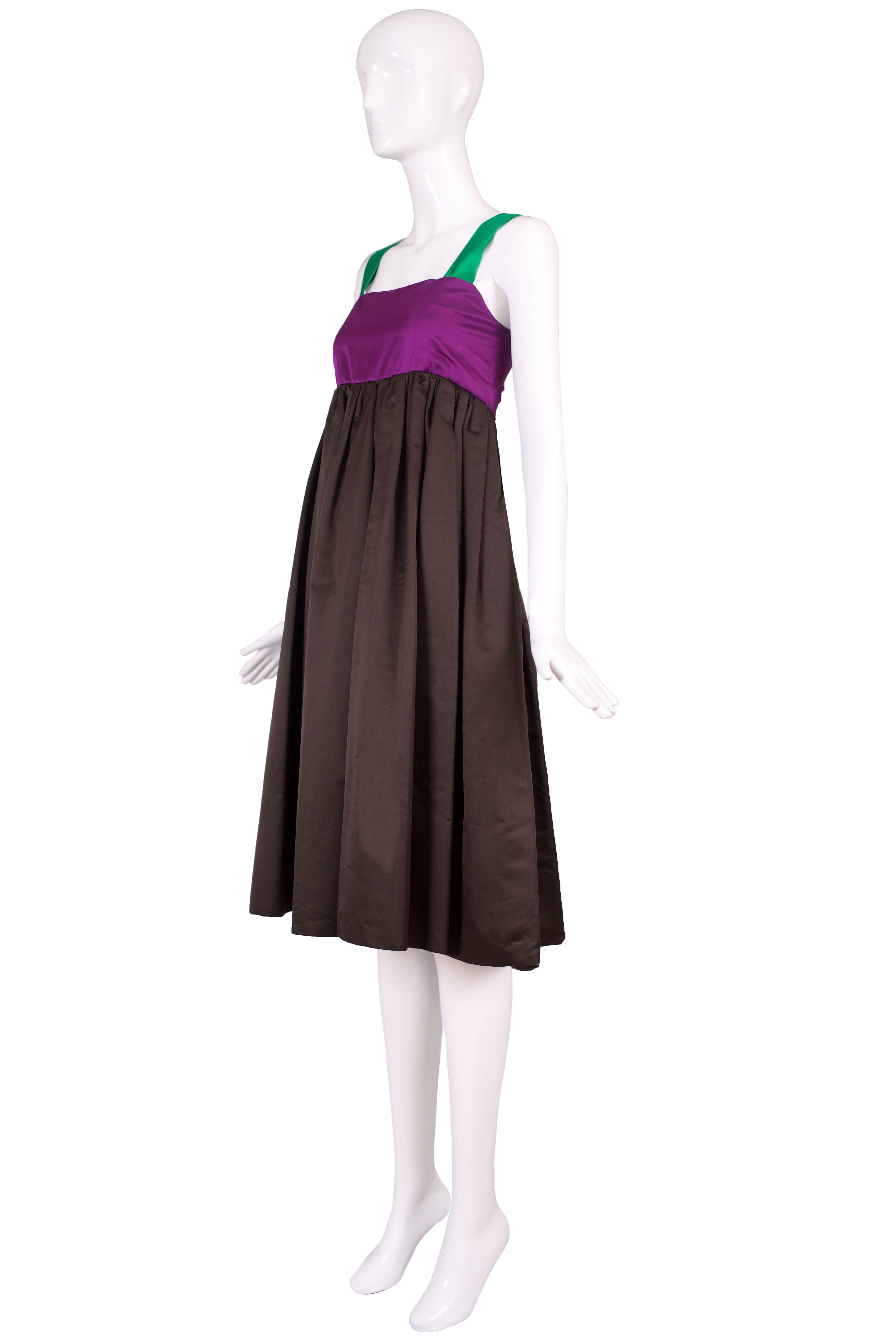 A Bill Blass purple, brown and green satin dress with a crinoline under the skirt. No size tag - so please consult measurements. In excellent condition.
MEASUREMENTS:
Bust - 34