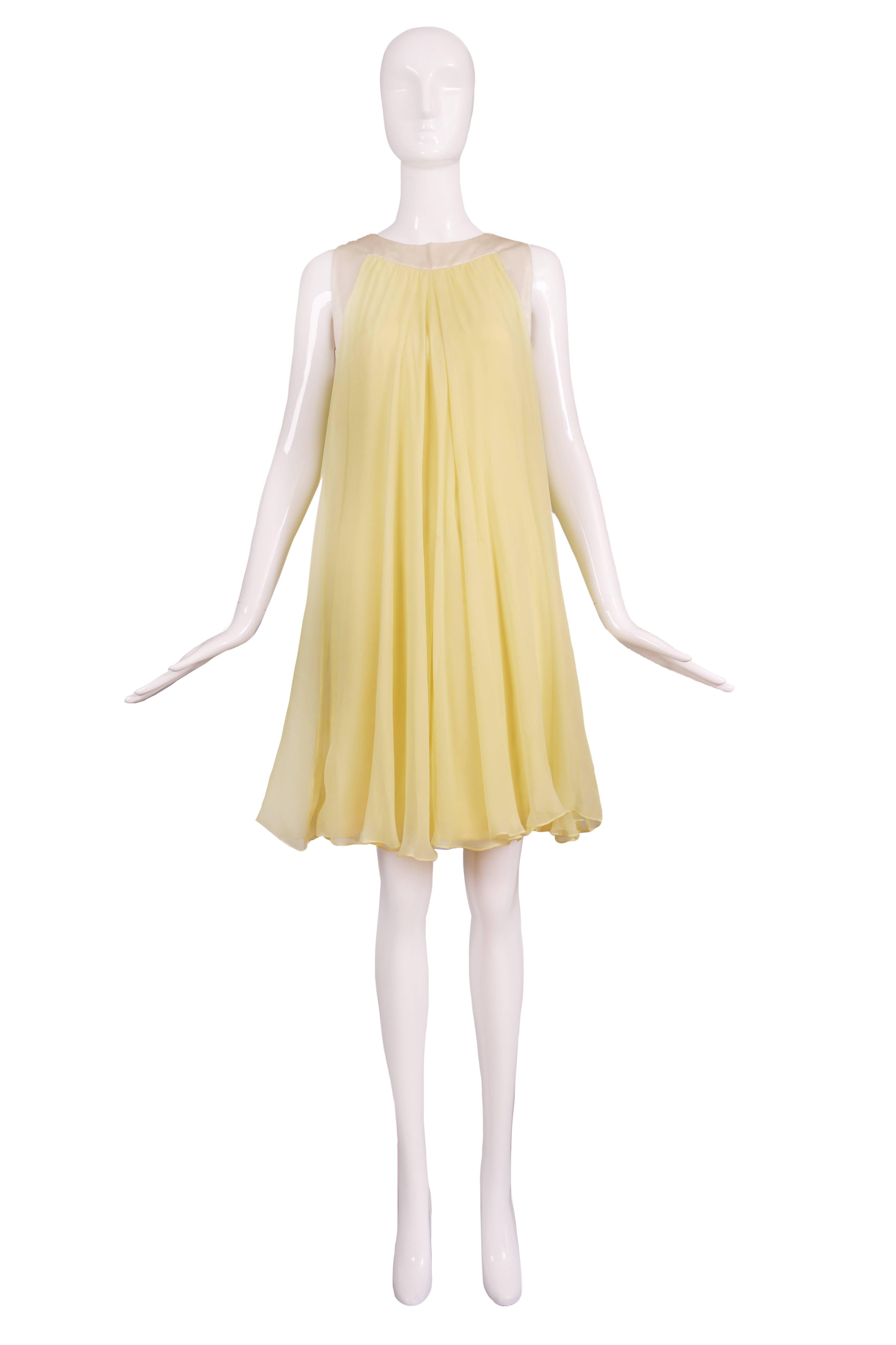 1970's Valentino yellow silk chiffon baby doll dress with pale yellow satin trim. In excellent condition. No size tag so please consult measurements.
MEASUREMENTS:
Bust - 35