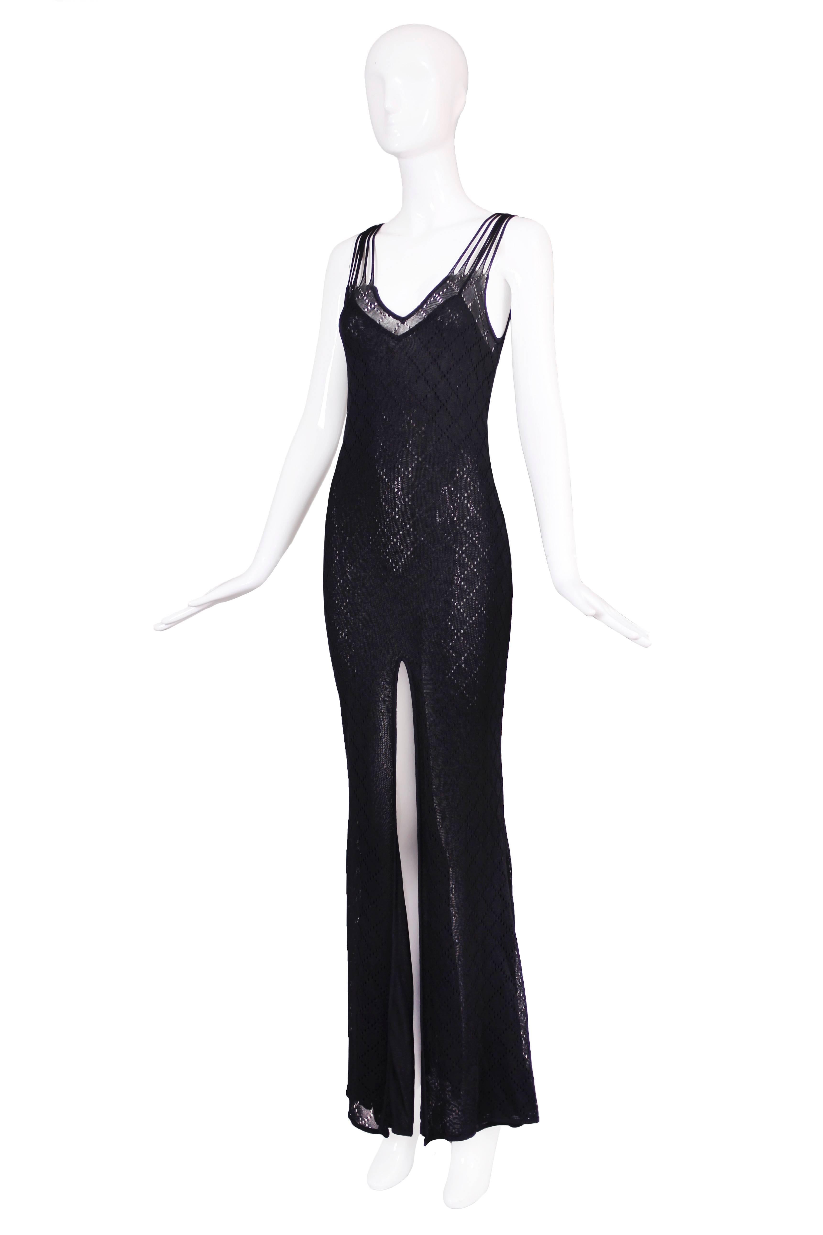 Christian Dior black sleeveless evening gown with dramatic frontal slit, diamond pattern and illusion back. In excellent condition. Size tag US 8, fabric is 100% viscose.