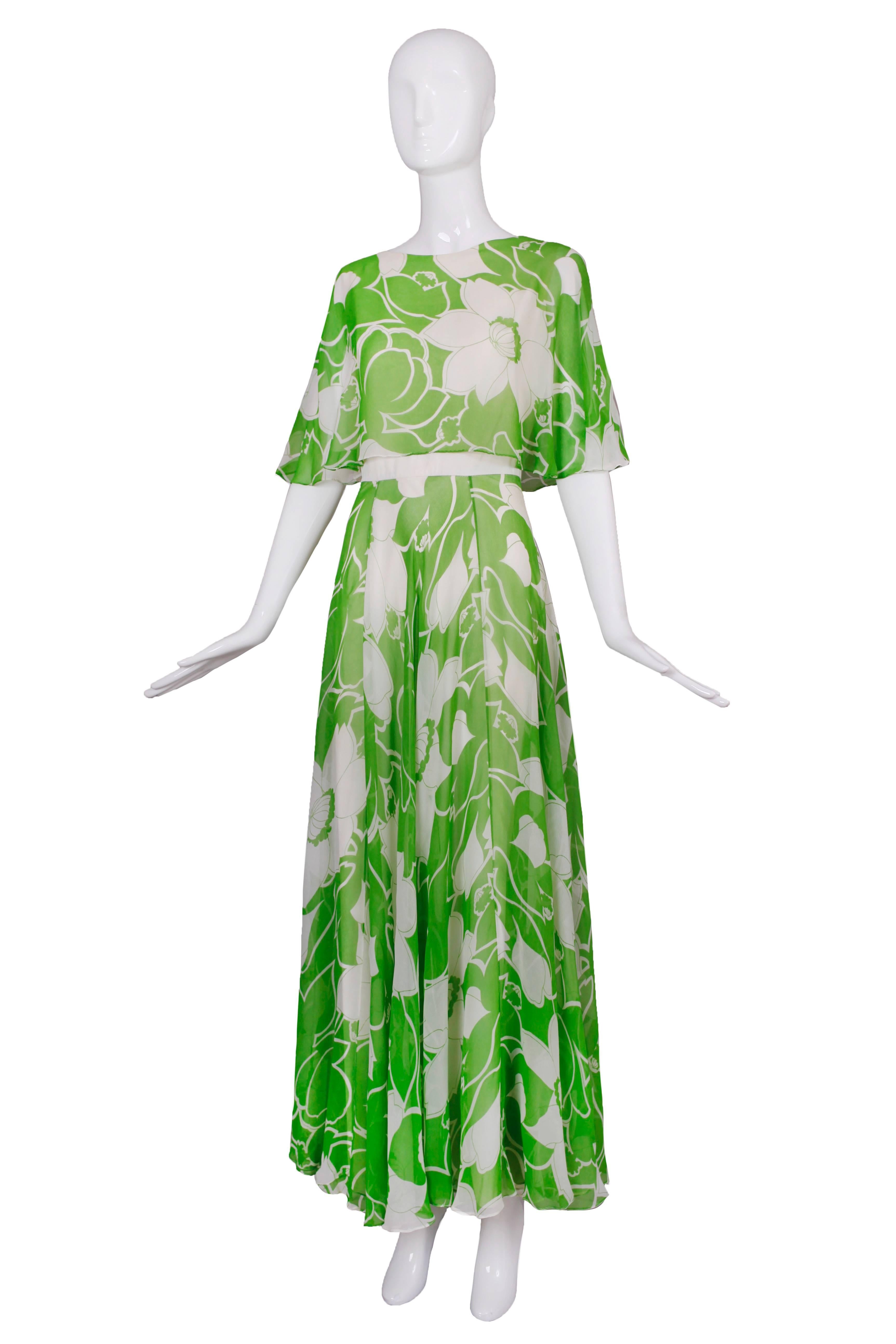 A 1970's Estevez rayon chiffon green and white floral printed garden party maxi dress. The dress is in fair  condition with holes and pulls scattered throughout - this is reflected in the price. No size tag please see