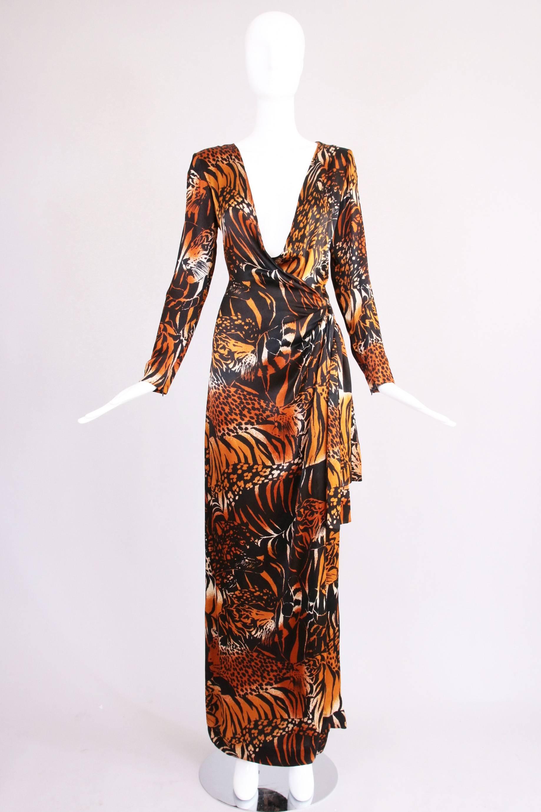 Vintage Yves Saint Laurent silk leopard print wrap evening gown with deep v-neck plunge and decorative half-sash at the hip. Size 38. In excellent condition.
MEASUREMENTS:
Waist - 26