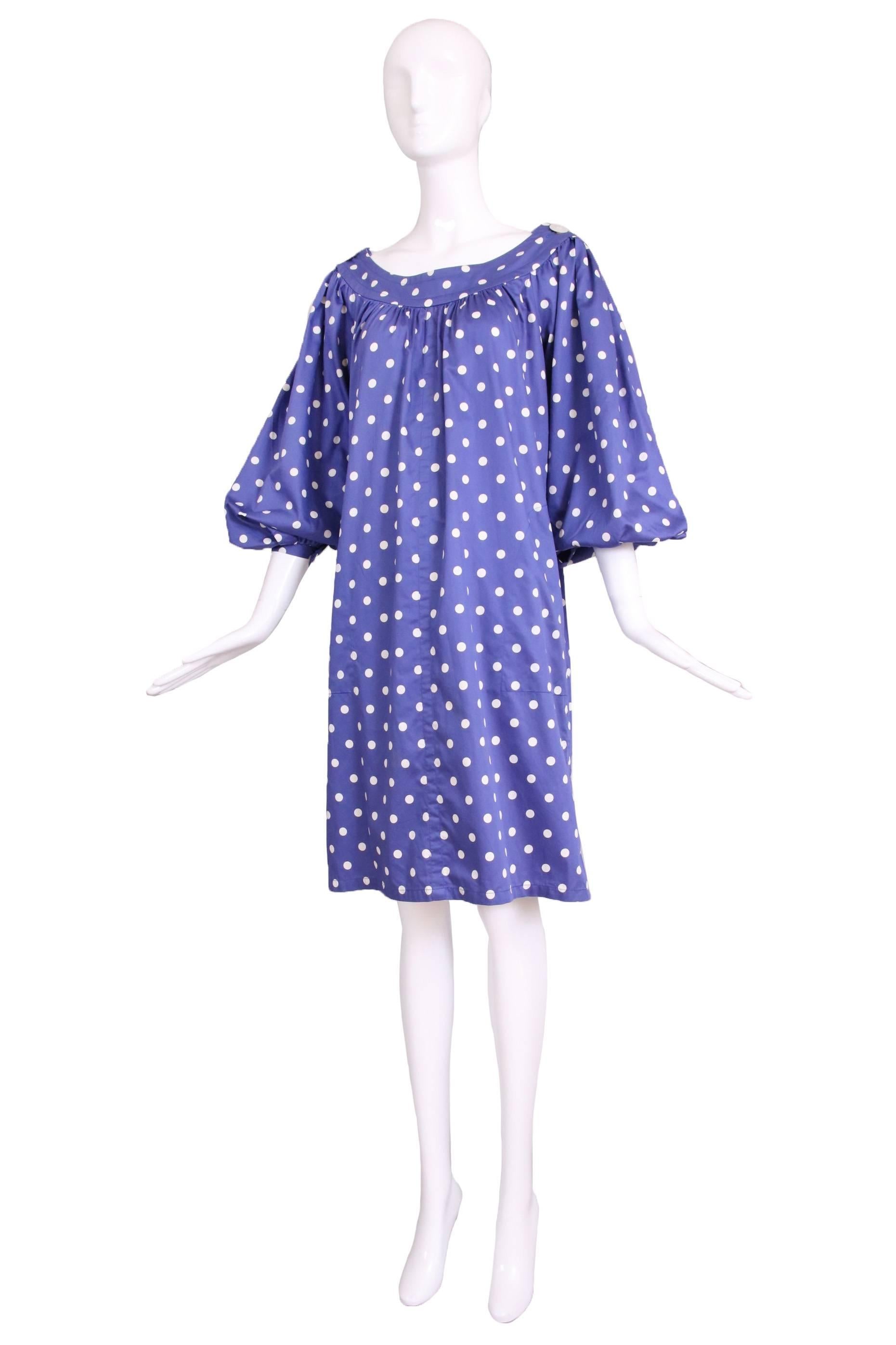 Yves Saint Laurent blue and white polka dot smock or tunic dress with oversize mother of pearl buttons at the shoulders and balloon sleeves. Features two side pockets. In excellent condition. No size tag so please consult