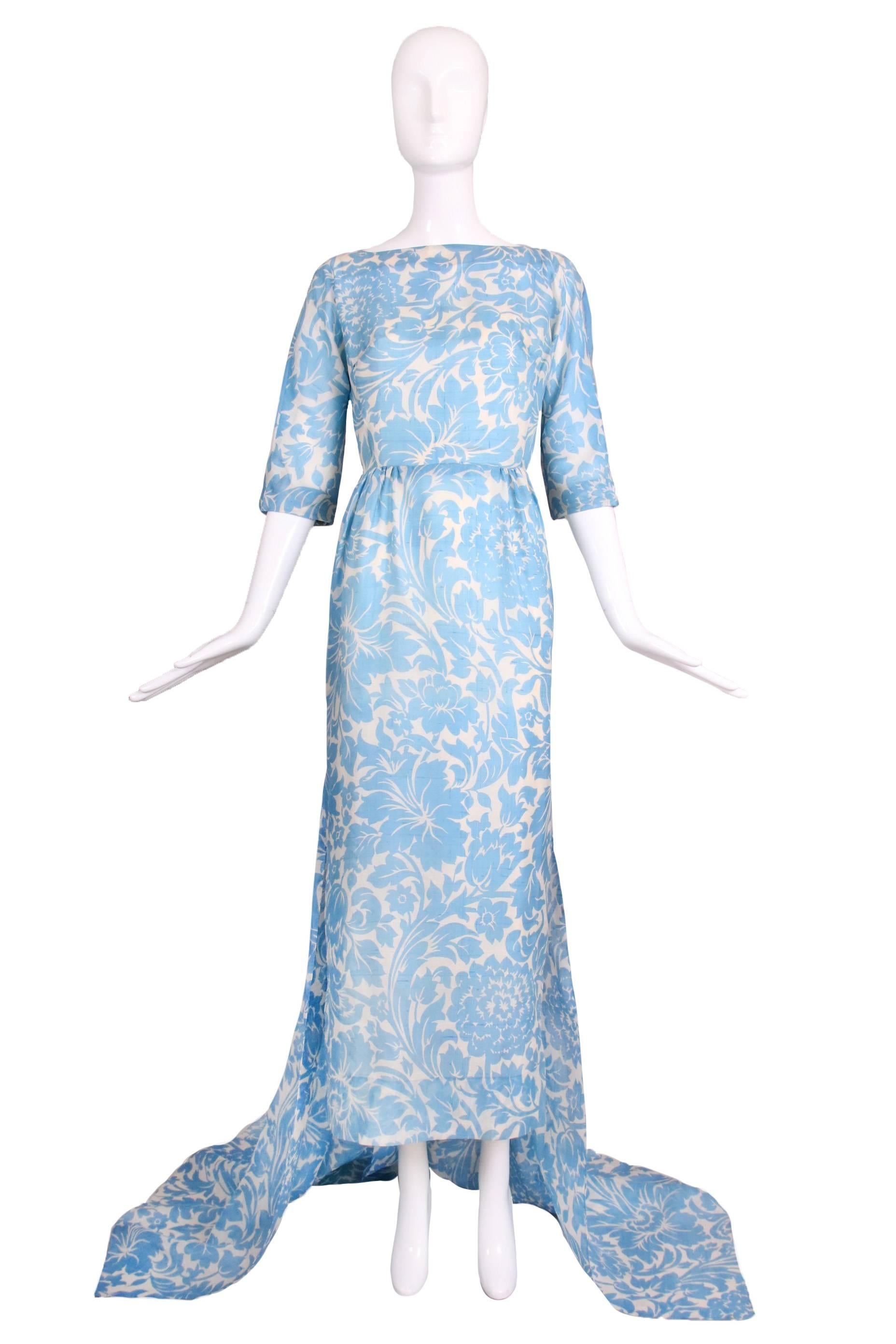 Vintage Pauline Trigere linen light blue and white floral gown with open back and train. Comes with white silk slip attached at the interior. In excellent condition. No size tag so please consult measurements.
MEASUREMENTS:
Bust - 34