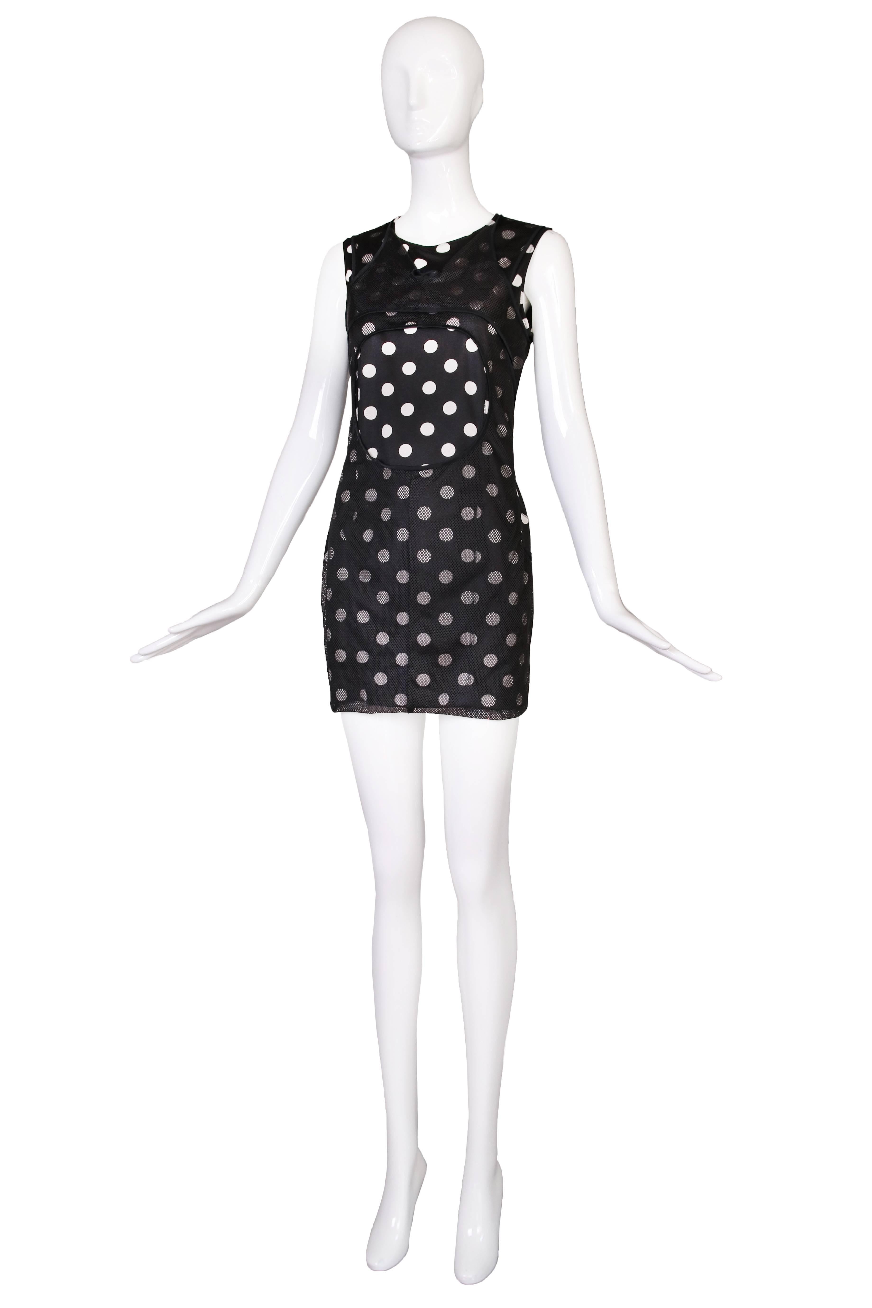 Junya Watanabe for Comme des Garcons sleeveless black and white polkadot stretch bodycon mini dress with mesh overlay featuring a circular cutout mid-bodice. In excellent condition. Size M.
MEAUREMENTS:
Bust - 36/38
