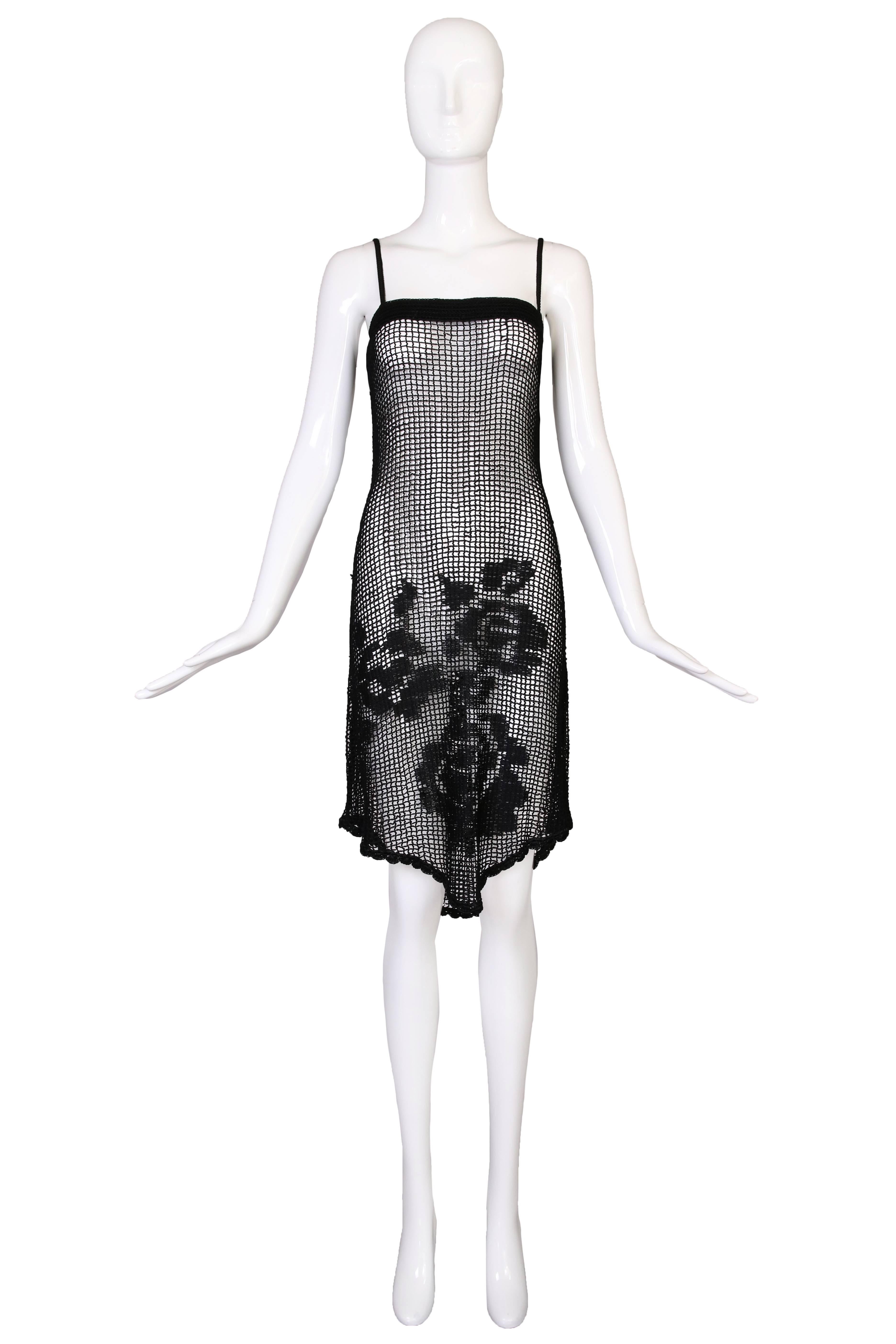 Dolce & Gabbana black crochet spaghetti strap dress with flower detail at the bottom front and dress back. Size M. In excellent condition.
MEASUREMENTS:
Bust - 36